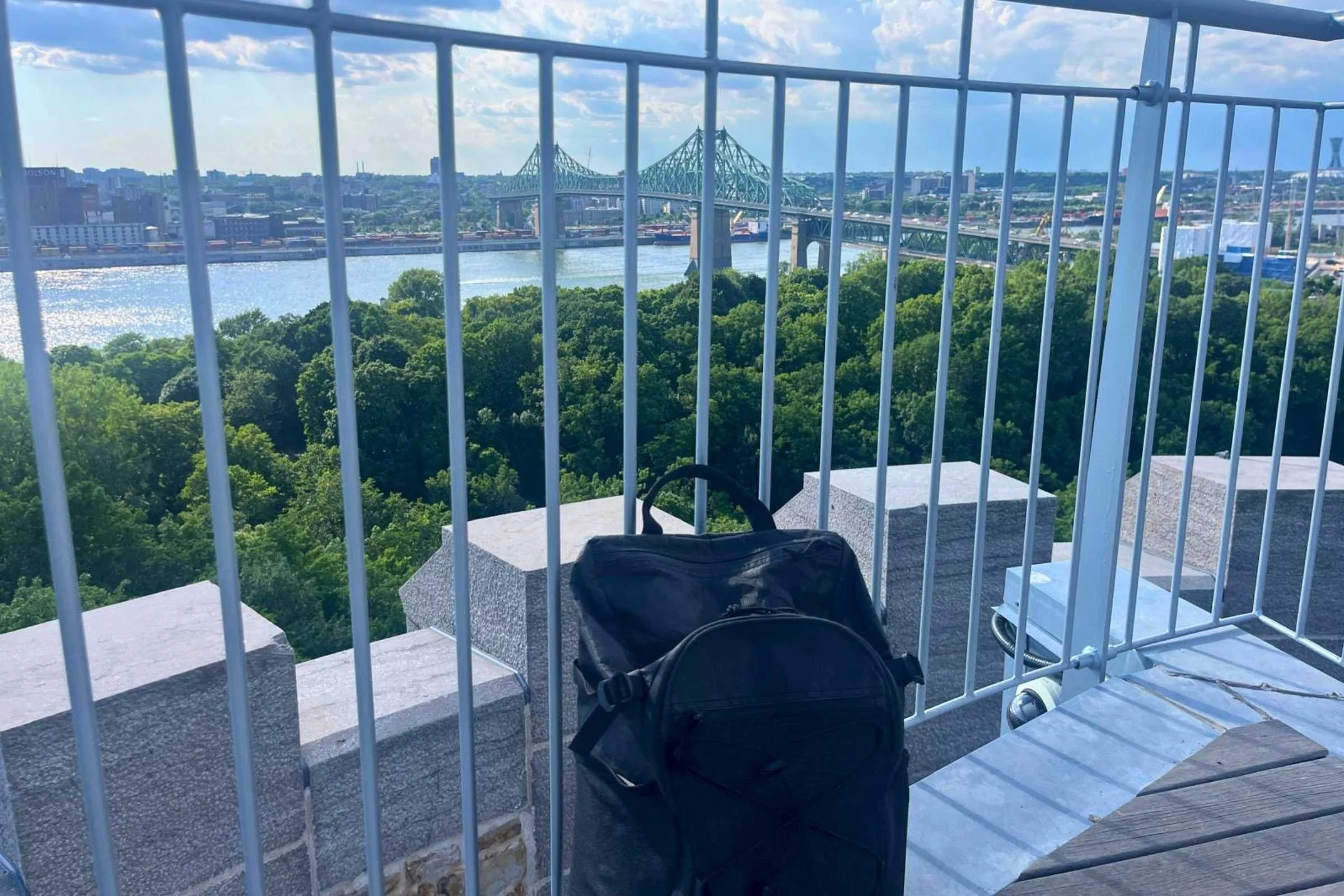ULA Ultra Dragonfly 30L Adventure Travel Backpack shown while traveling with an outdoor scenic background.