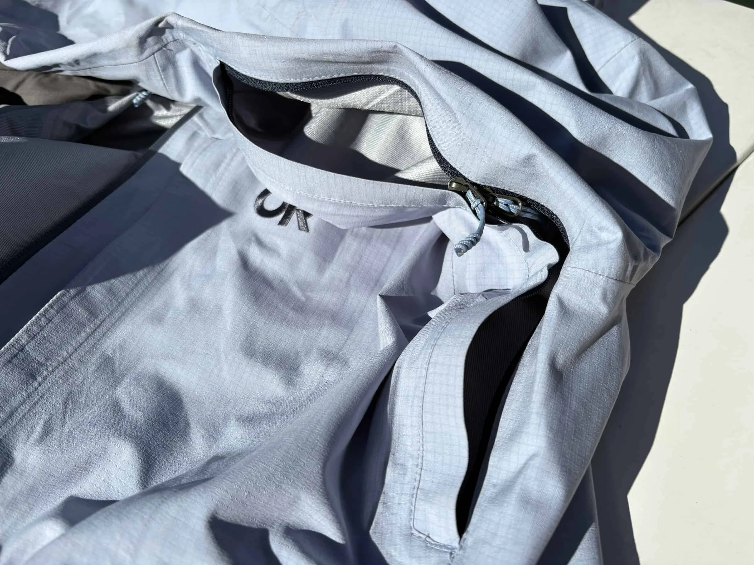 Dual-zippered pit zips open from either end on the OR Carbide shell snowboard jacket