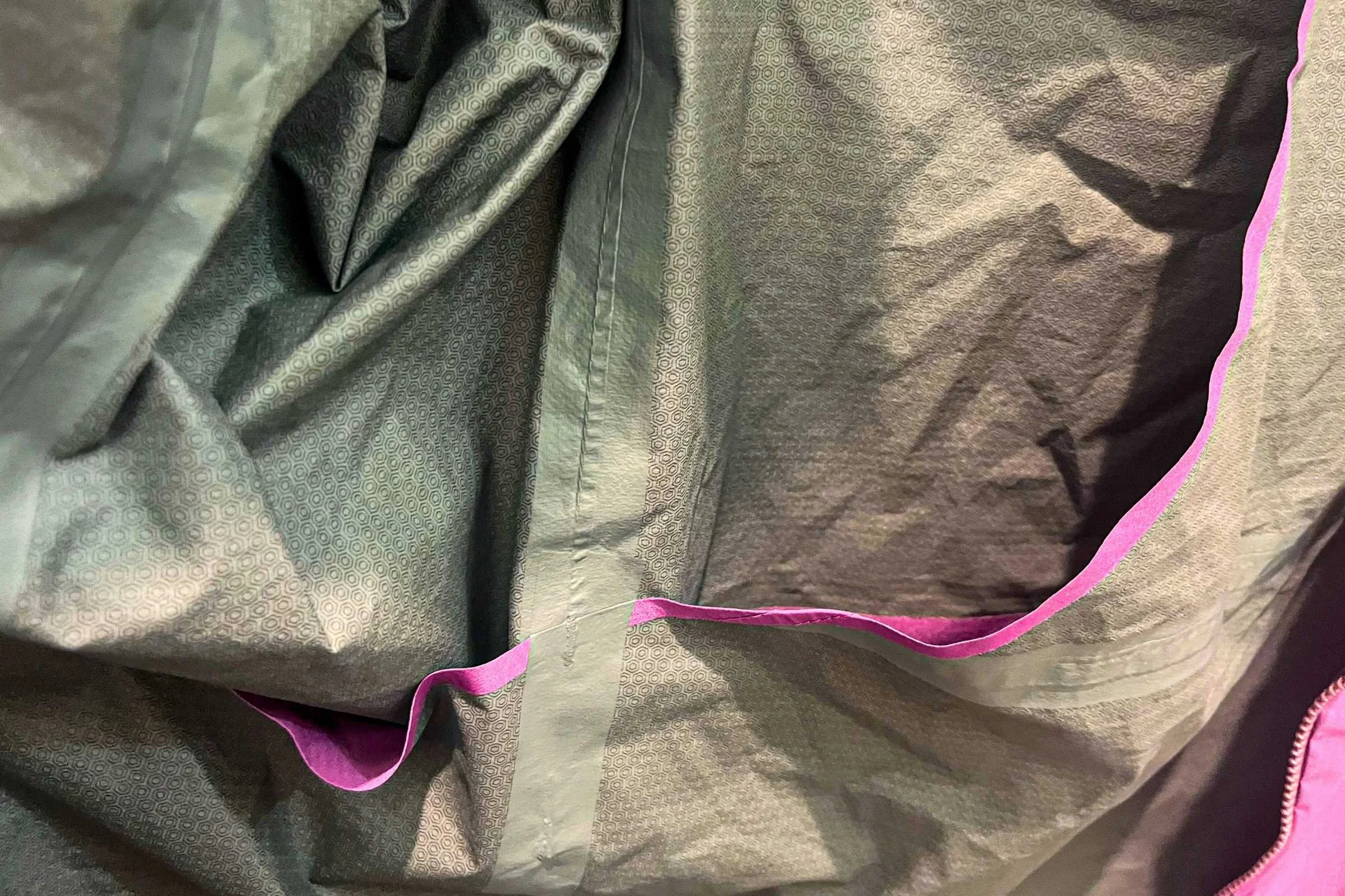 The Janji Rainrunner has waterproof taped seams to truly be a waterproof layer. This is a feature you’ll pay extra for vs. water-resistant jackets, which don’t have taped seams.
