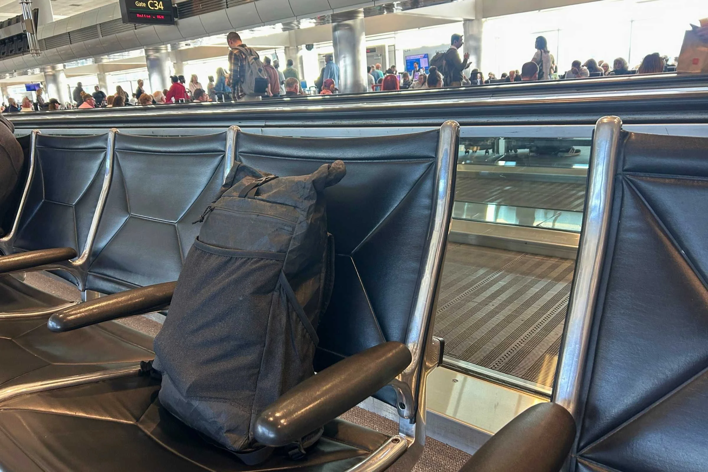 the ula ultra node 20l backpack on a chair at an airport