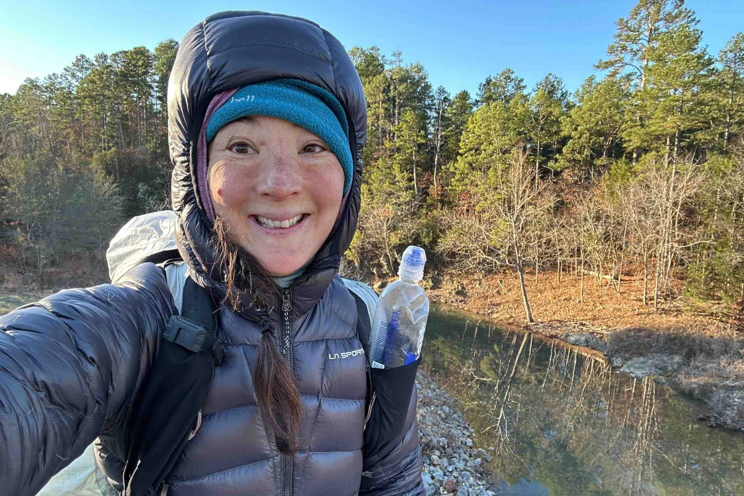 The author thru-hiking with the Mountain Hardwear Alakazam backpack in freezing temperatures on the Ouachita Trail.