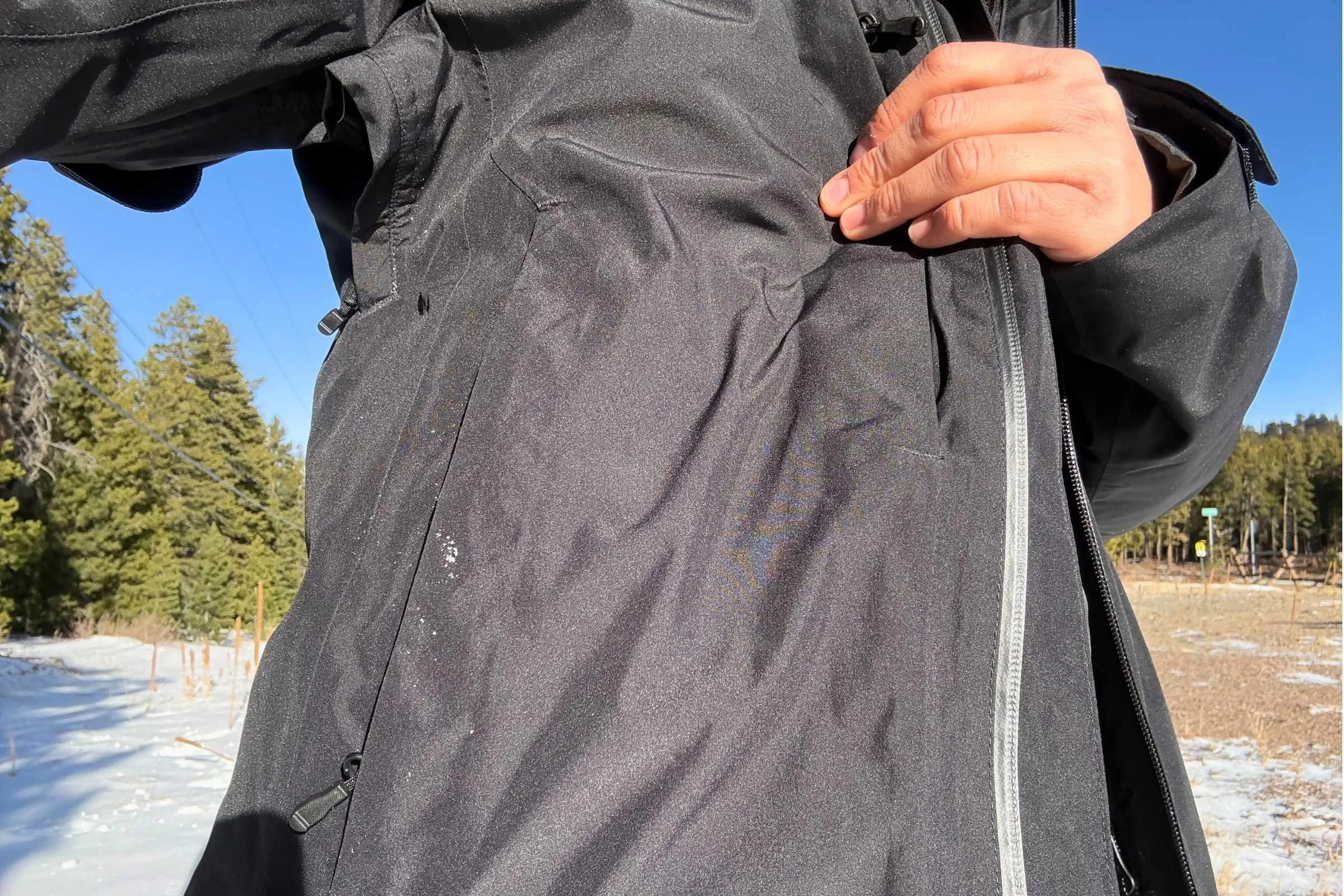 The North Face Thermoball Triclimate snowboard jacket zippers on the front of the jacket