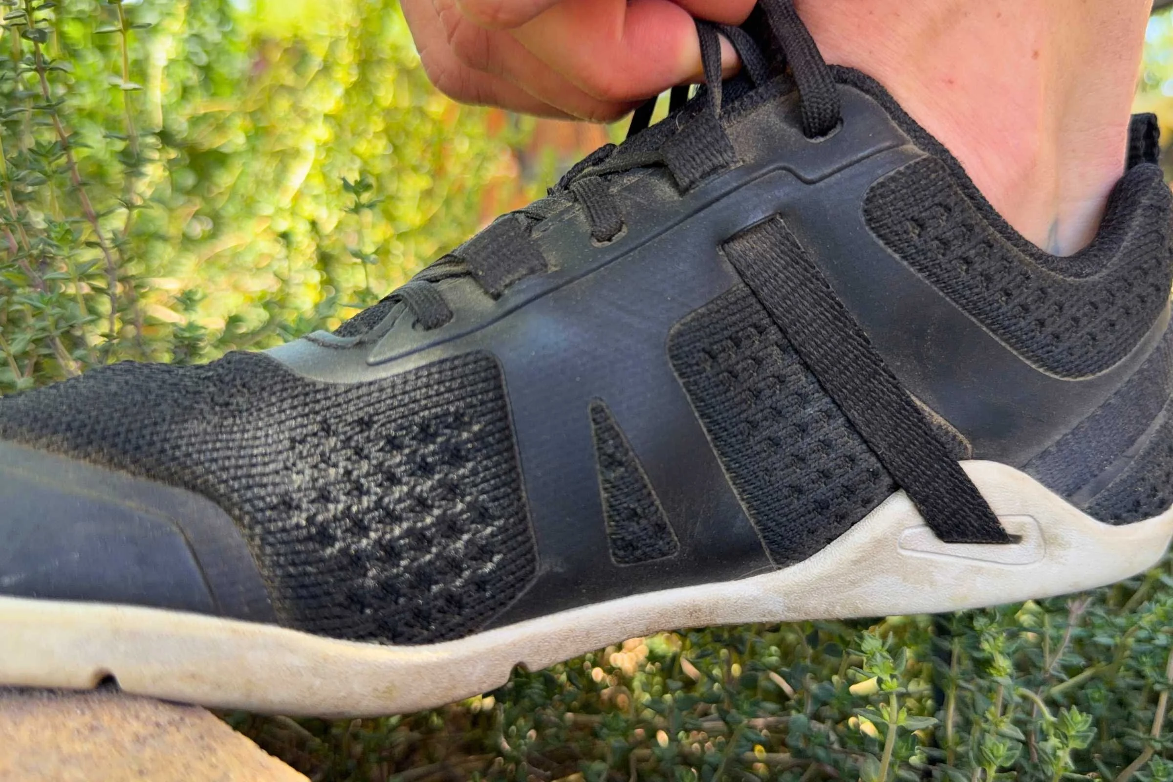 Adjusting the laces, instep, and heel of the Xero Prio Neo. Photo courtesy Maggie Nichols