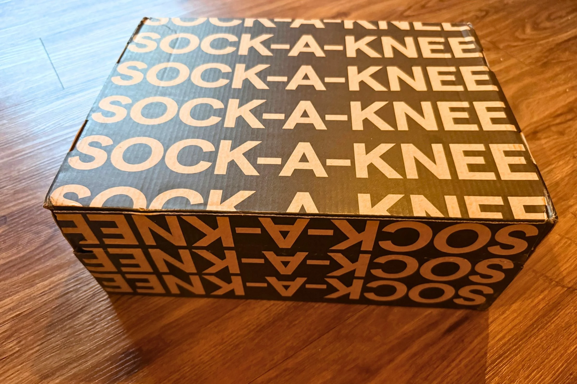Saucony Triumph 24 shoebox printed with ‘sock-a-knee’ branding