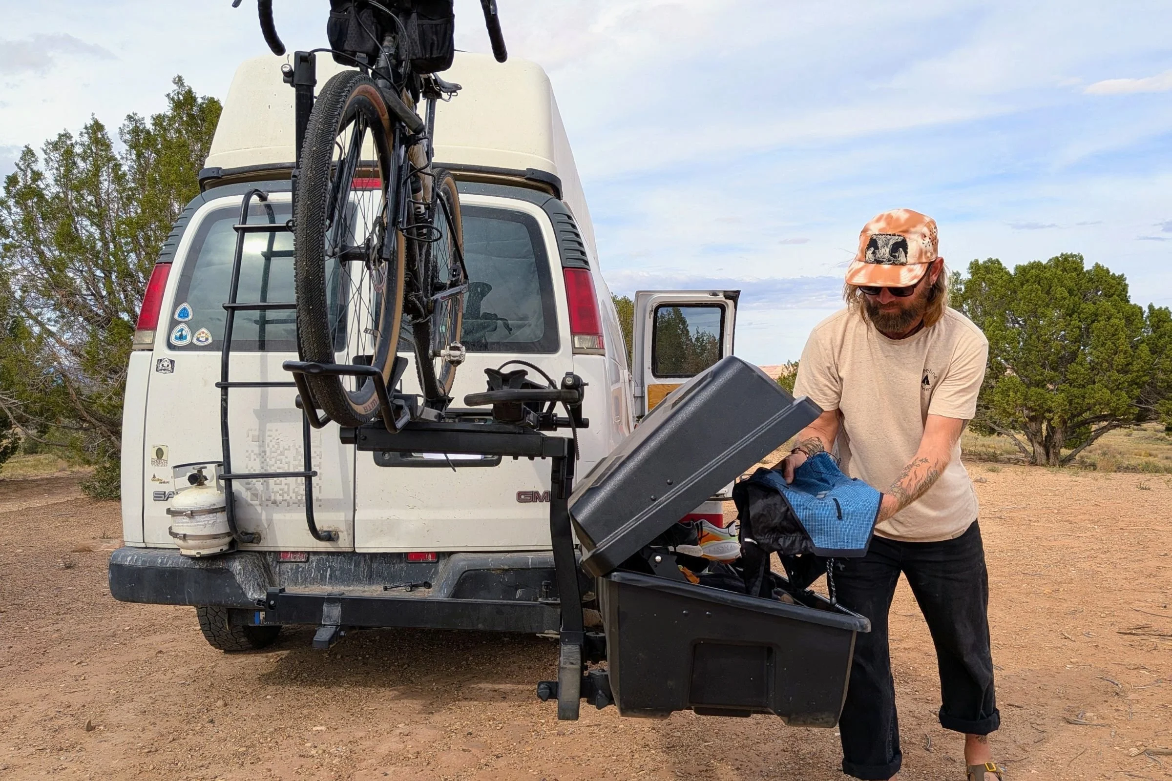 Tester removing gear from the Yakima EXO GearLocker while rotated out from the vehicle on a SwingBase