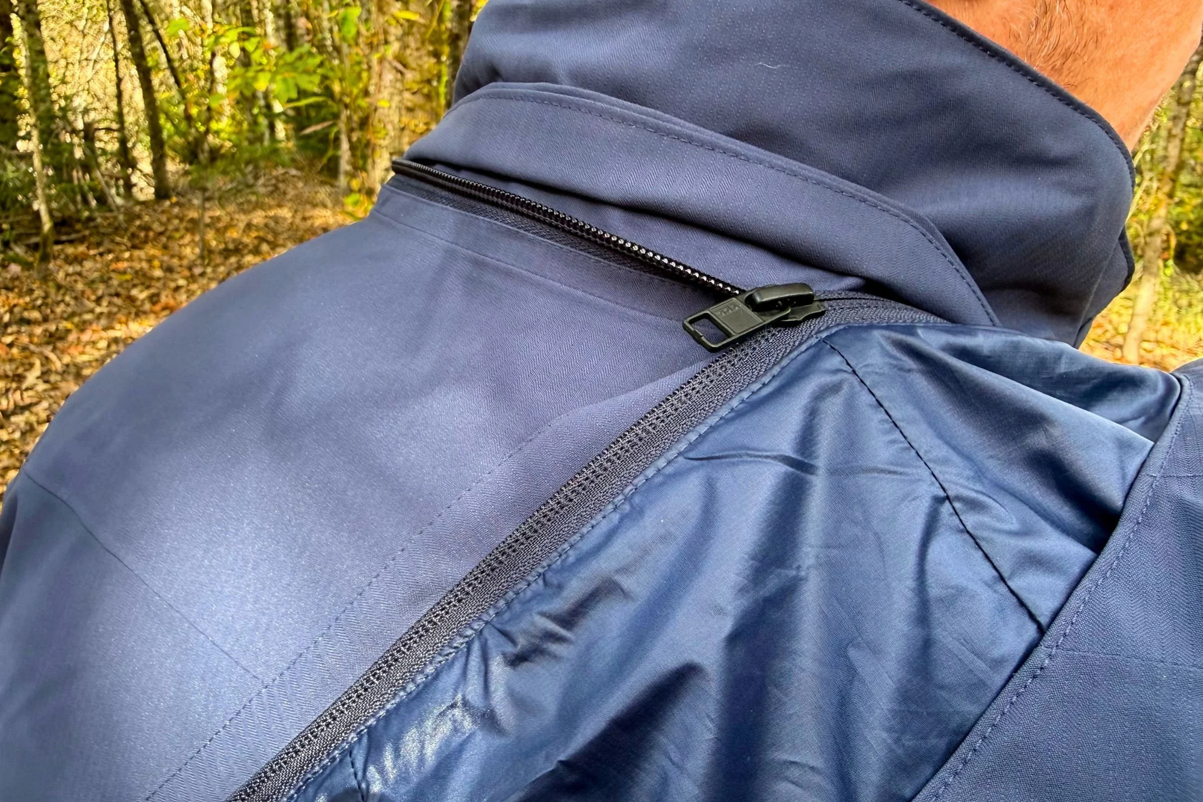 The hood is removable with a zipper, making it quick to detach and re-attach.