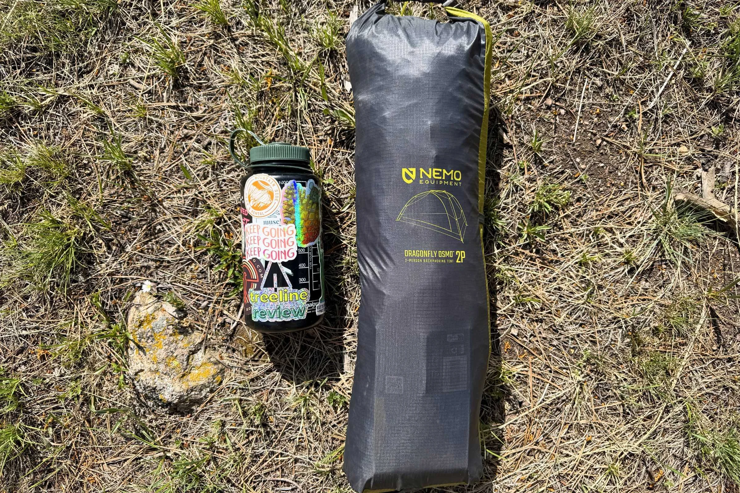 The packed size of the 2P Dragonfly OSMO (1L Nalgene bottle for scale).