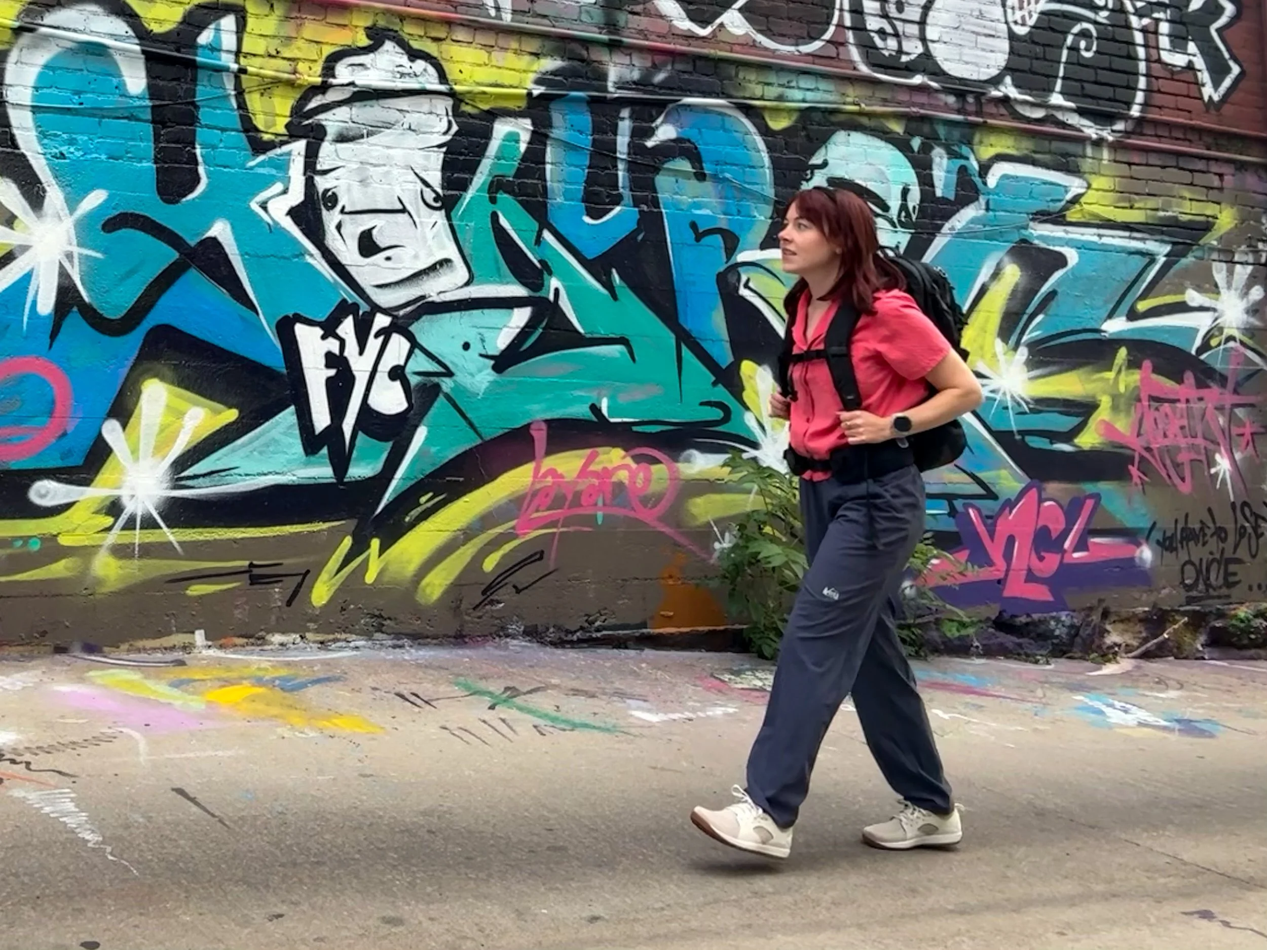 The author walking with the Matador Global Travel Backpack in the city