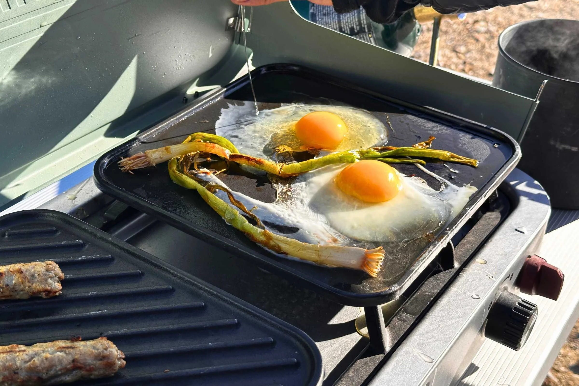 Wind guards protecting flames on Coleman Cascade stove