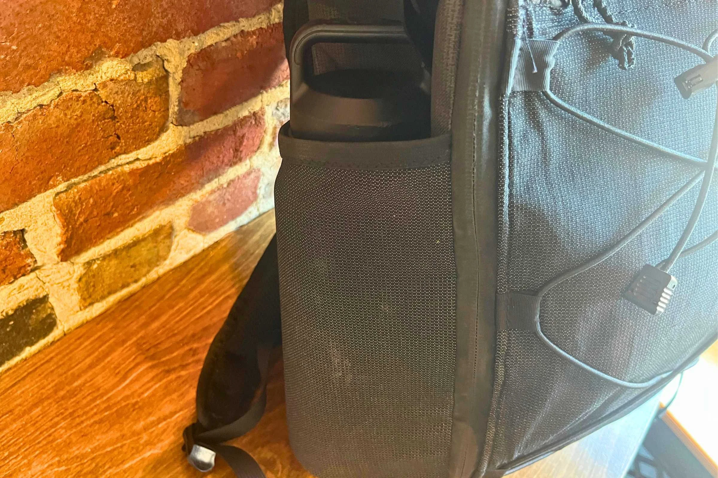 ULA Ultra Dragonfly 30L Adventure Travel Backpack with a water bottle in the side pocket.