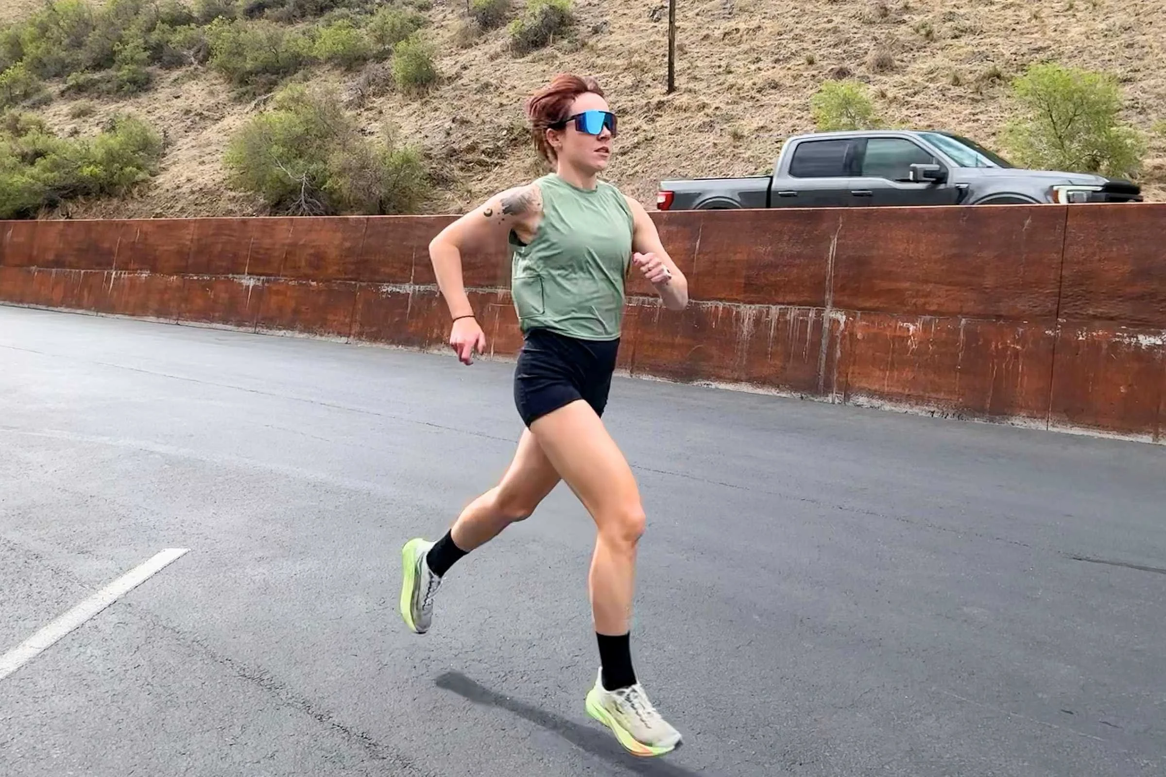 the author running in the HOKA Mach 7 road running shoes in a parking lot