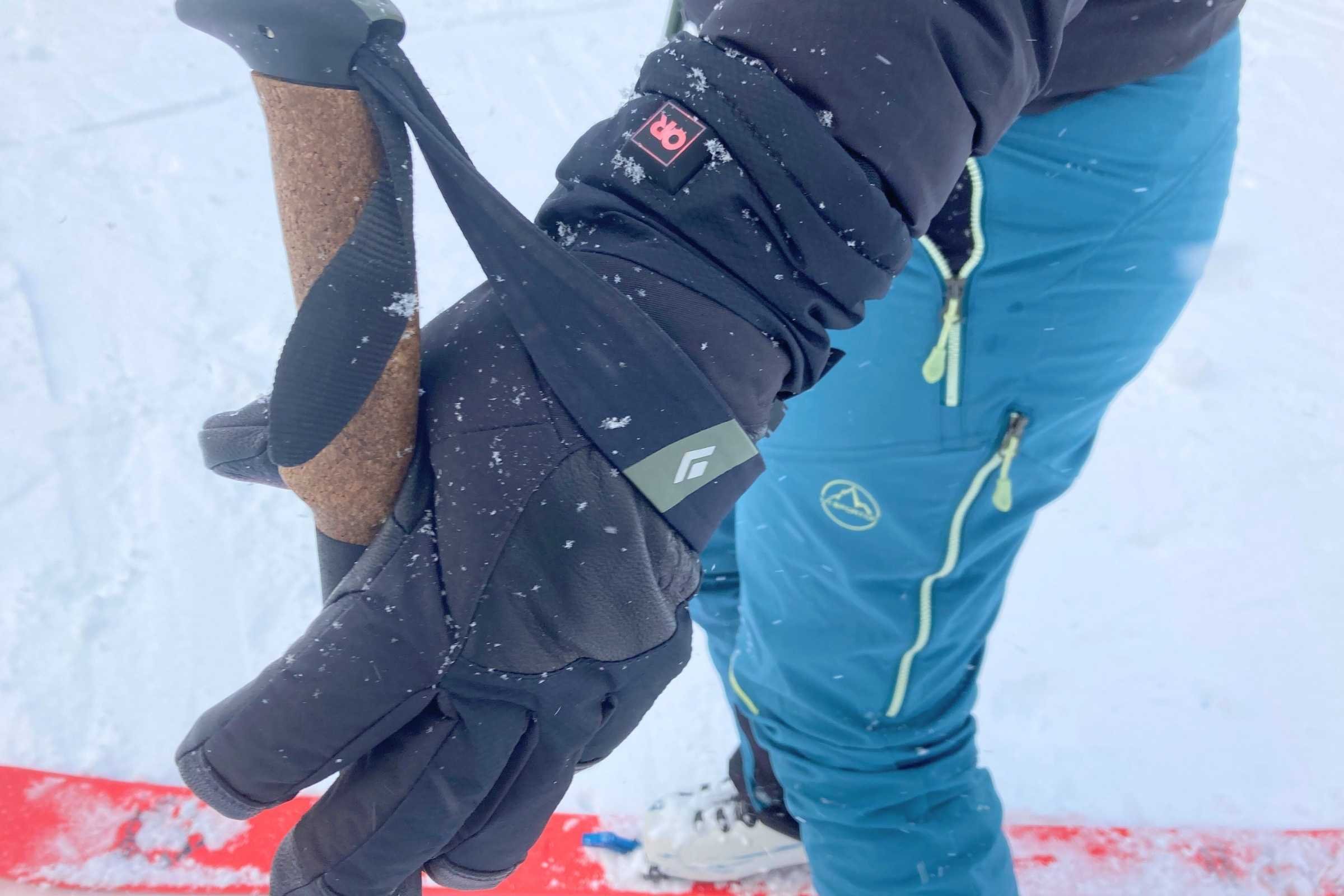 Outdoor Research Prevail Heated GTX gloved handed holding onto a ski pole