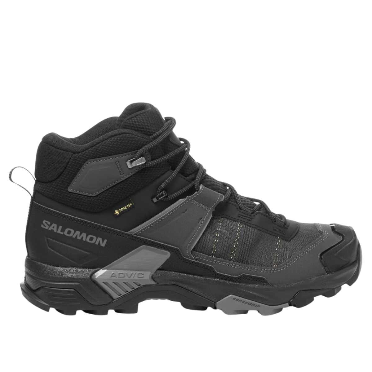 Side view of a charcoal and black Salomon X Ultra 5 Mid GTX hiking boot with a padded ankle and lugged sole.