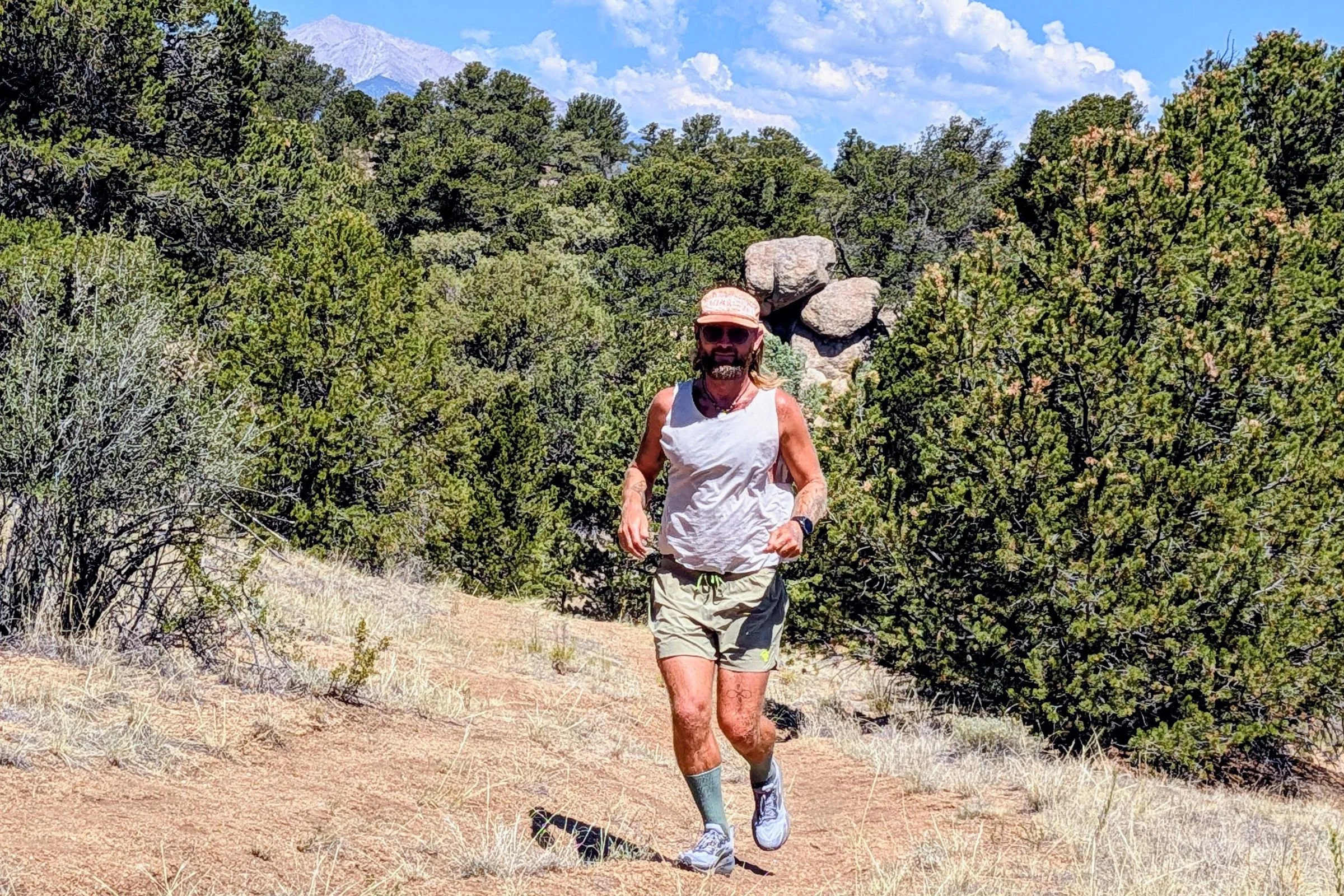 Man trail running in Brooks Ghost trail running shoes.