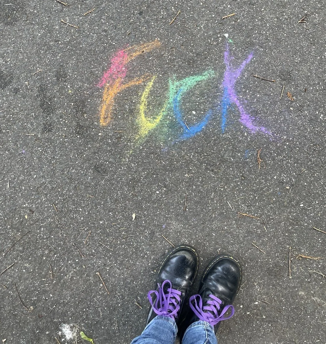 rainbow chalk that reads the f-word