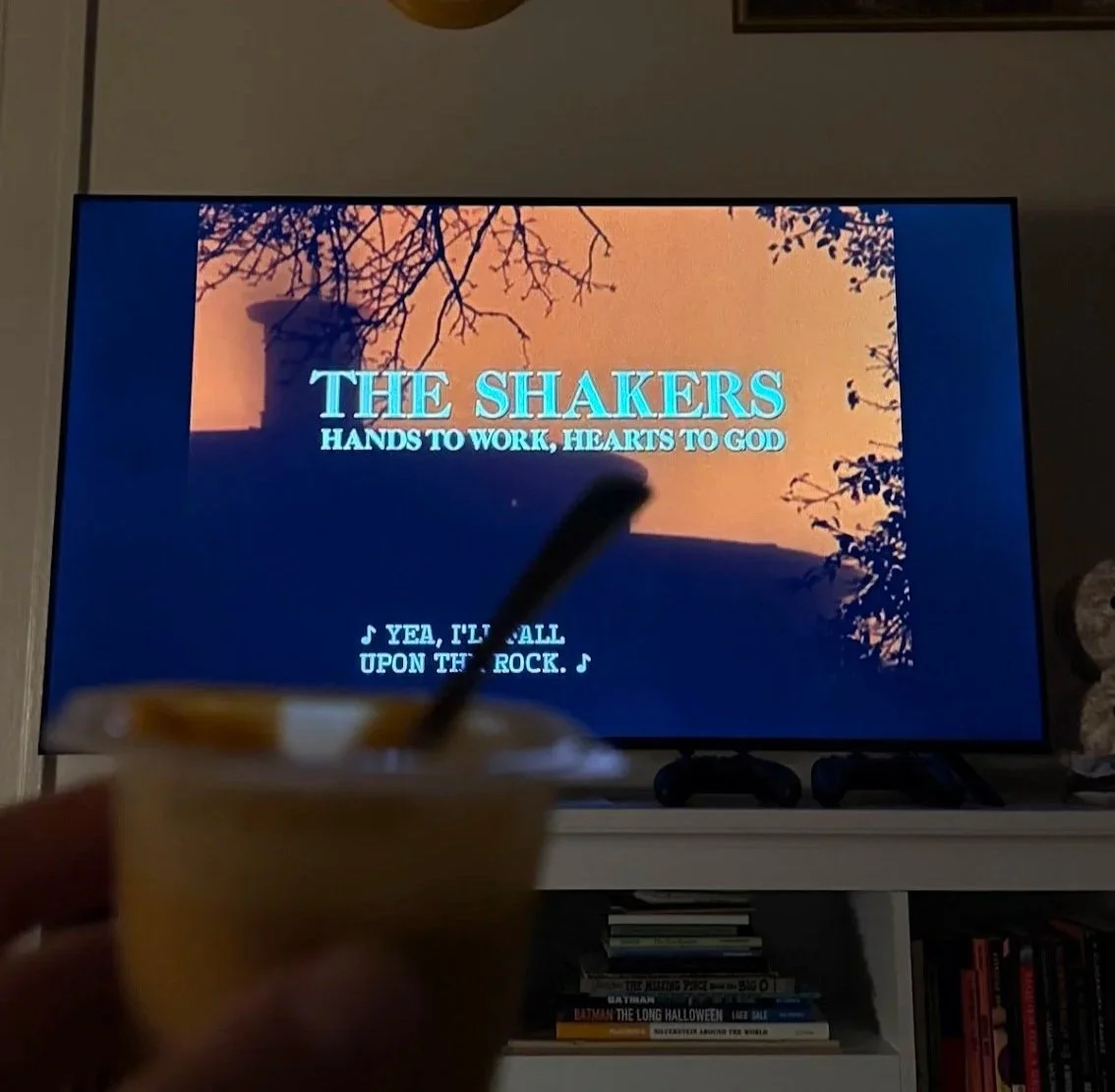 pudding cup in front of Ken Burns Shaker documentary