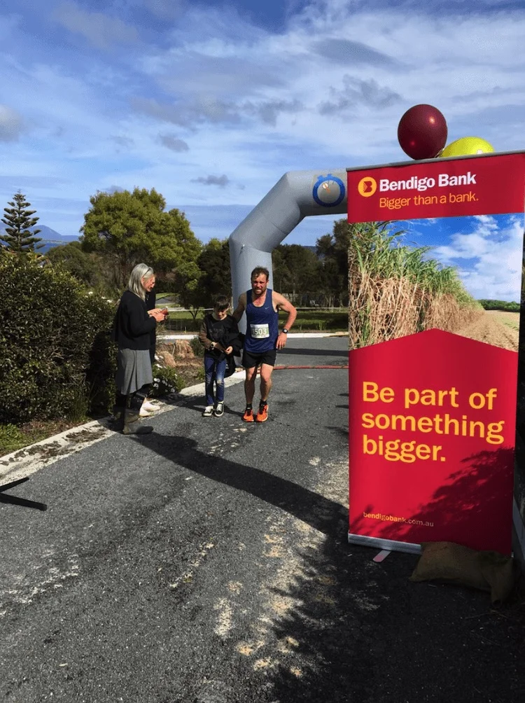 Fig 2 Brett Blythe, winner of the Pub to Pub 2017, crossed the finish line and was greeted by his young son.