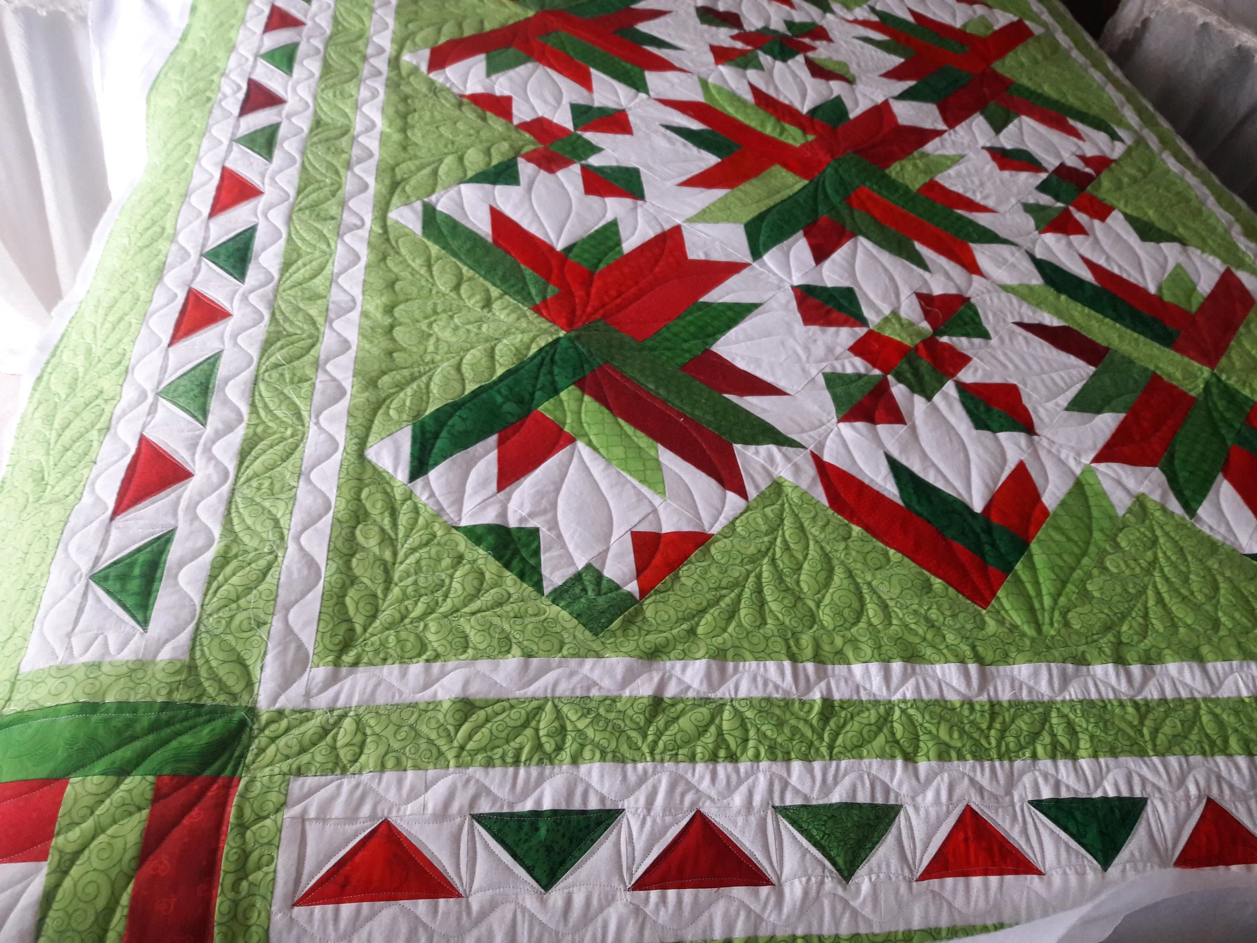 The lady who pieced this quilt changed the border layout somewhat. It looks like she added extra borders which is great way to enlarge a quilt