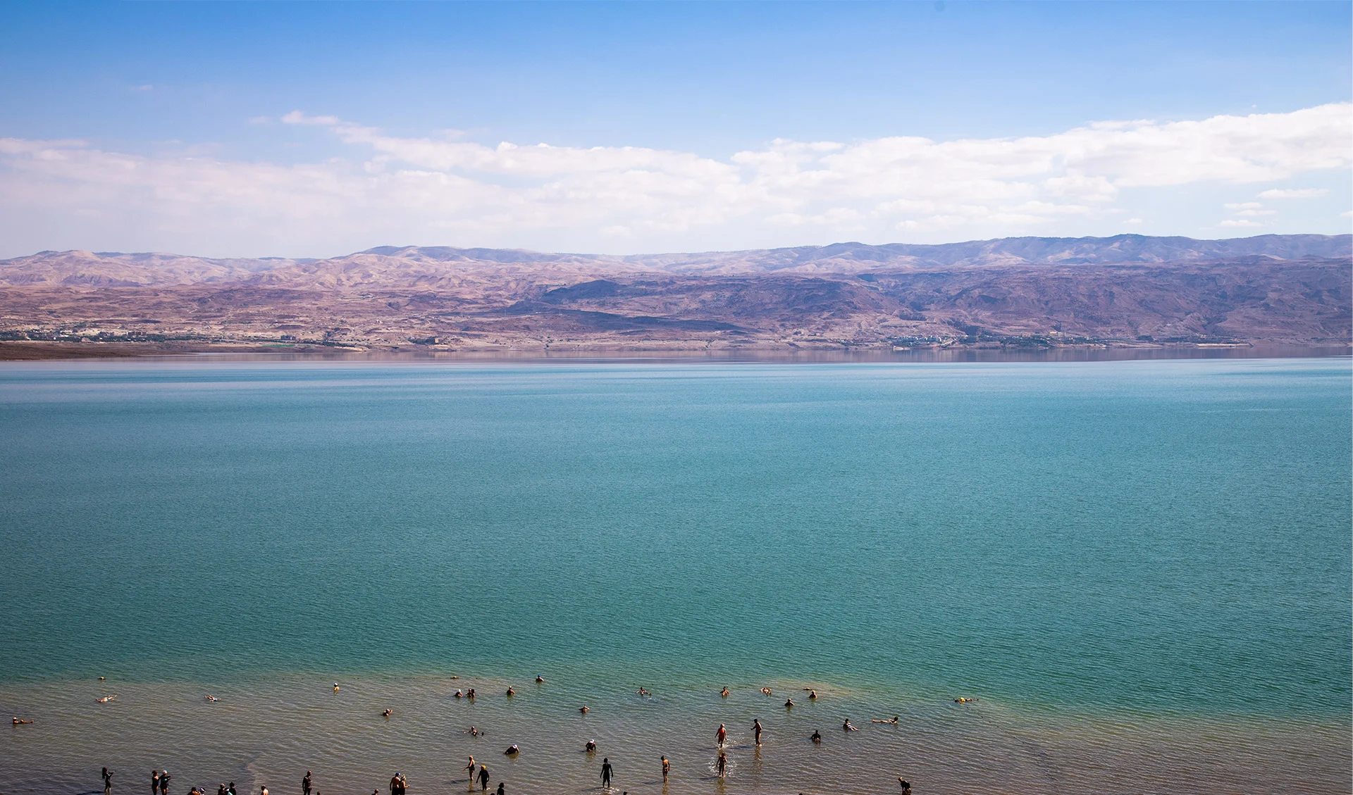 'Floating' in the Dead Sea — Israel (with Jordan in the background)