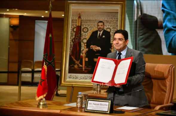 Moroccan Foreign Minister, Nasser Bourita, holds a copy of the agreement between Morocco and the UN for the establishment in Morocco of the UN Office of Counter Terrorism.
