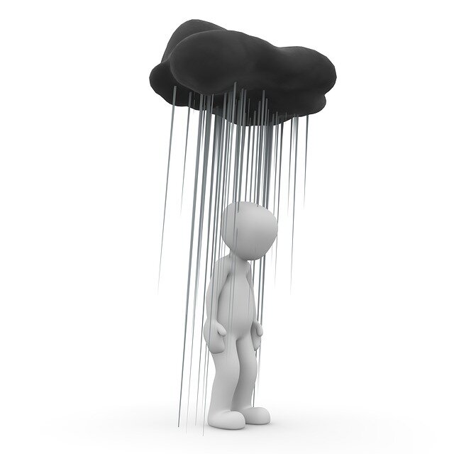 Cartoon of man under a rain cloud
