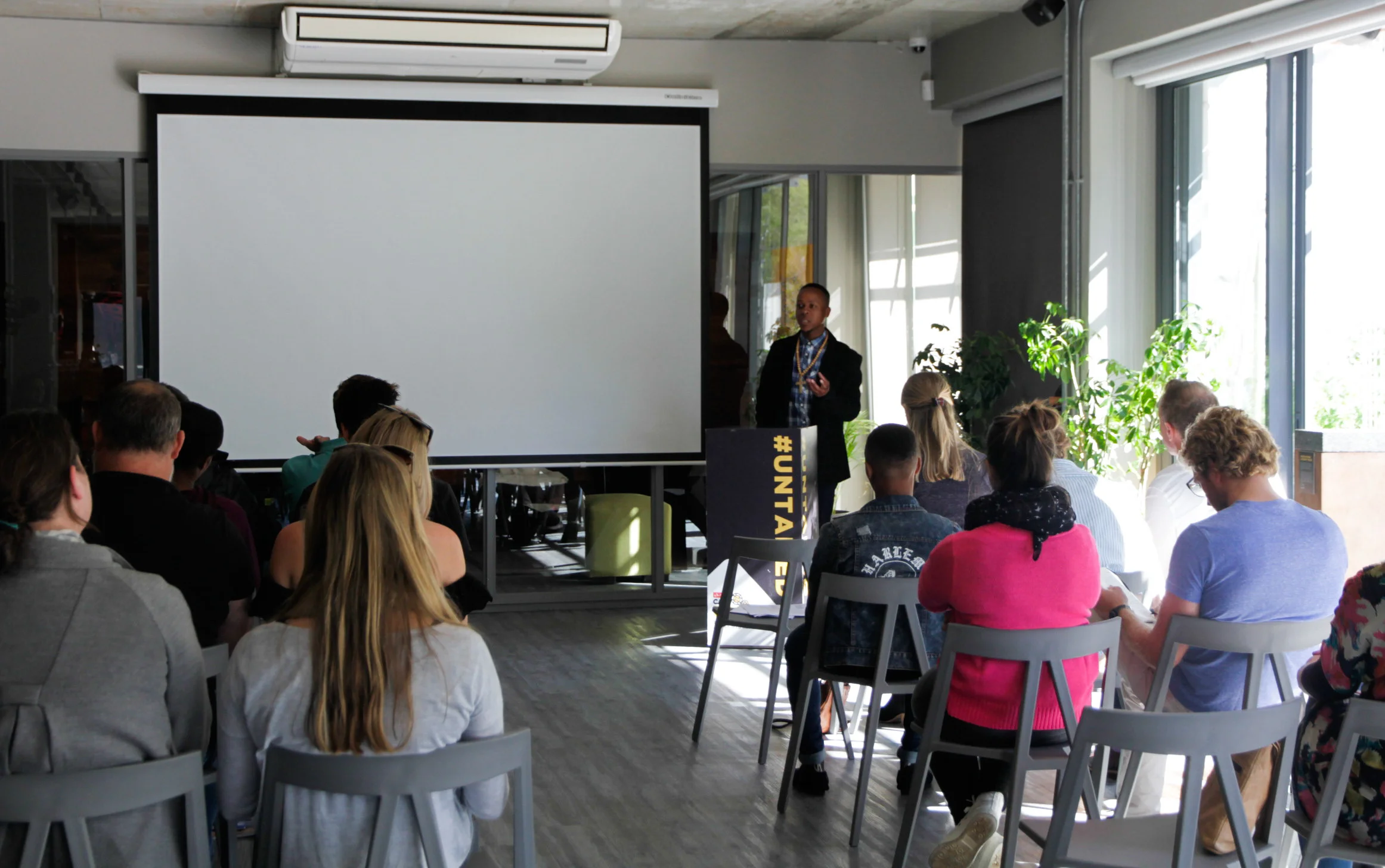 One of the graduates talking at the graduation ceremony about his experiences