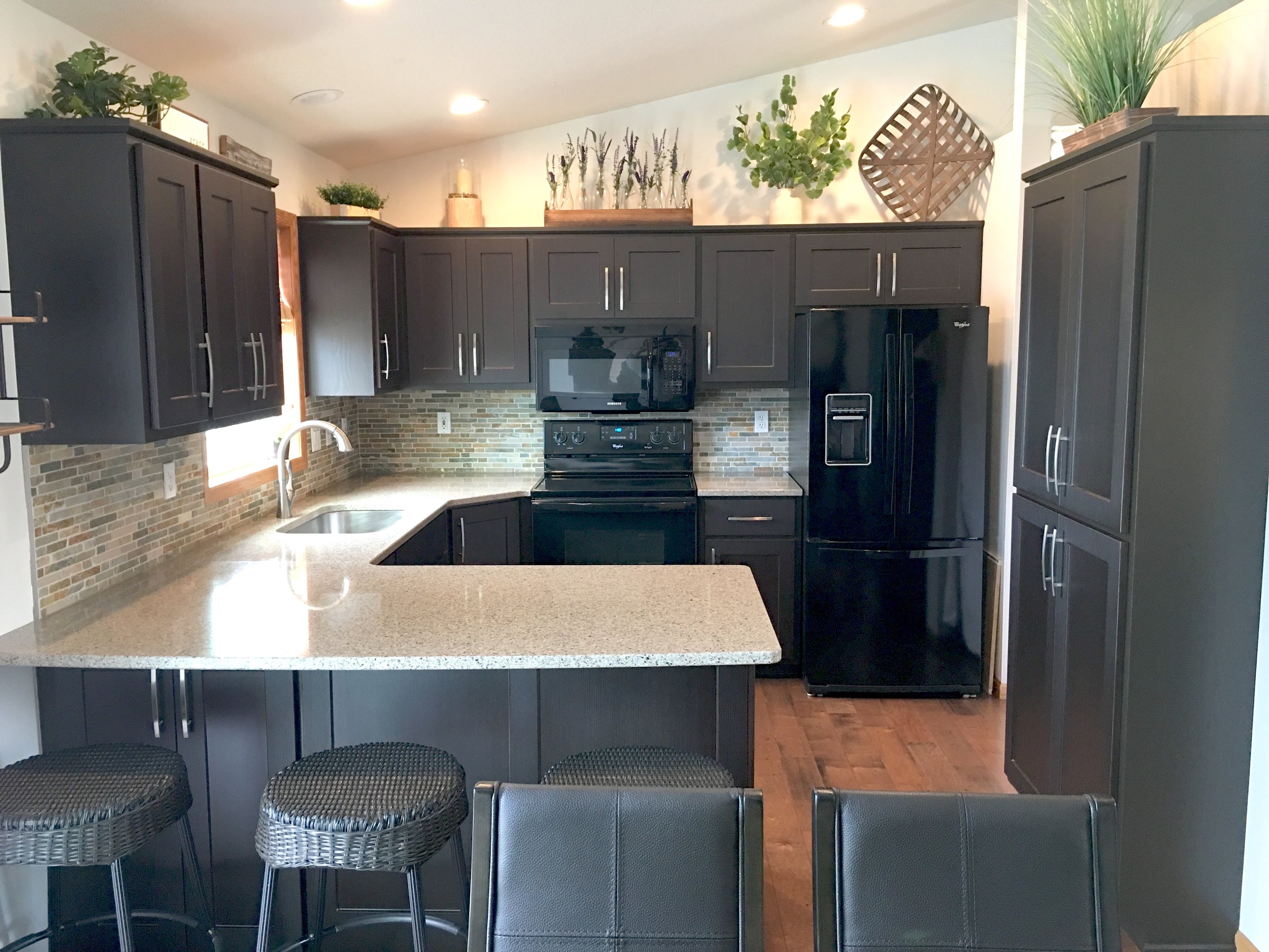 AFTER: Our rich, dark Zanno Wenge on all new doors and drawer fronts converted the existing cabinets of this kitchen from dated to divine!