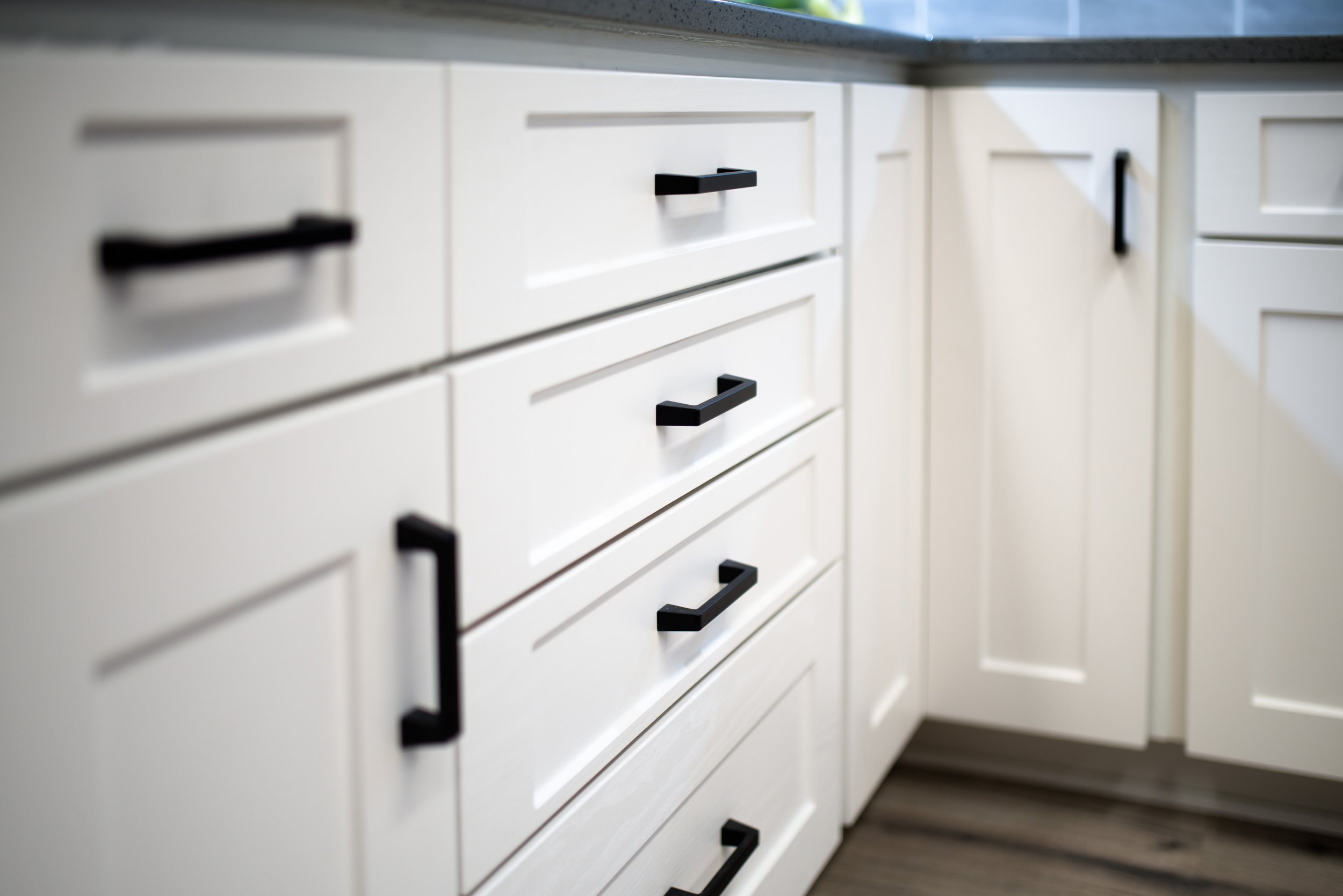 milwaukee studio lower cabinet and hardware view to llazy susan corner.jpg