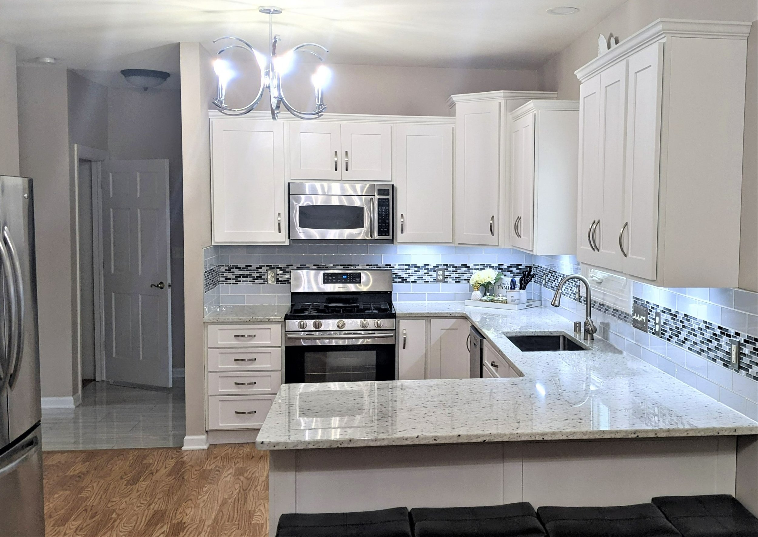 white kitchen with backsplash accent after remodel