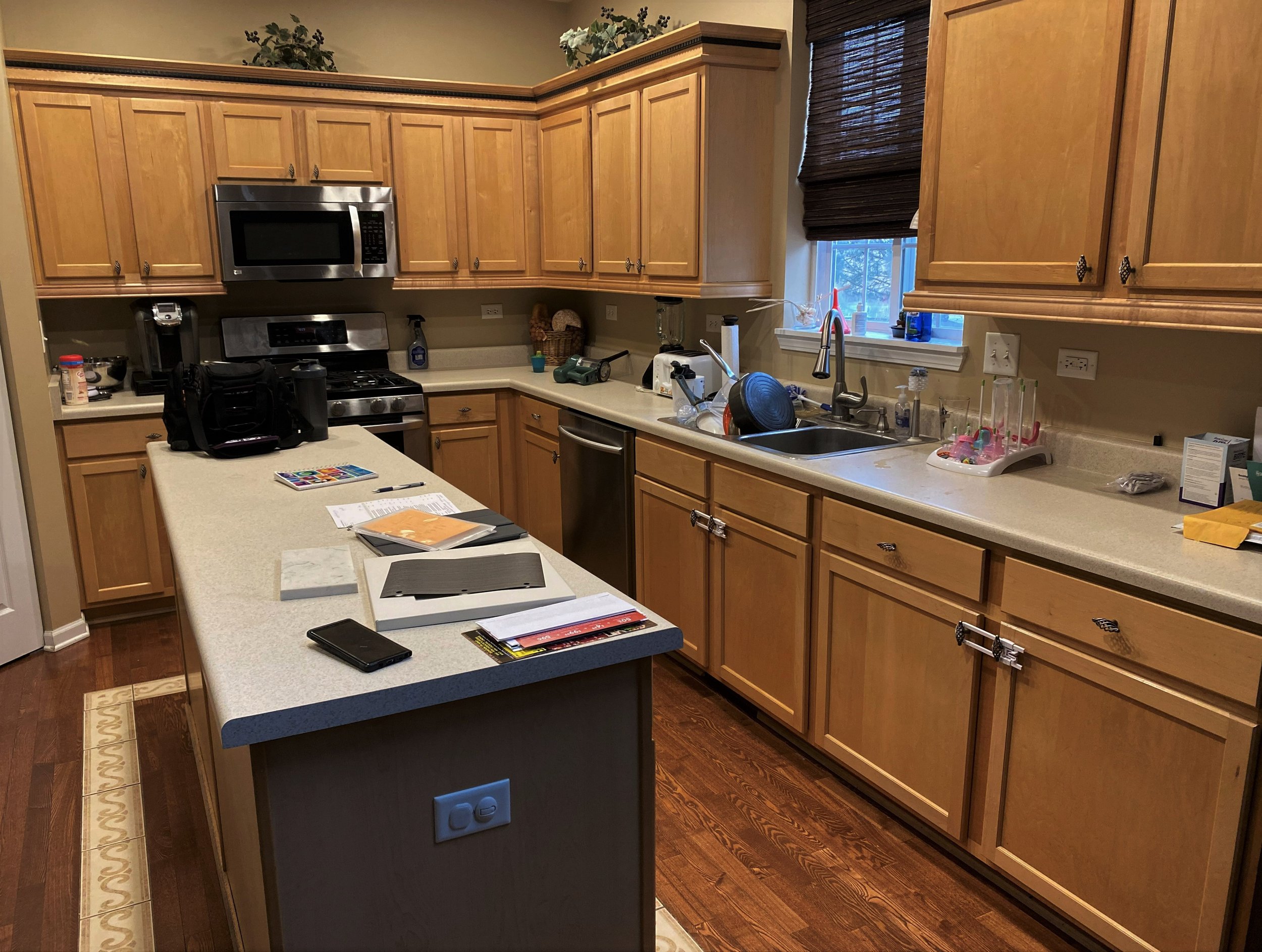 before kitchen remodel dated wood tone cabinets