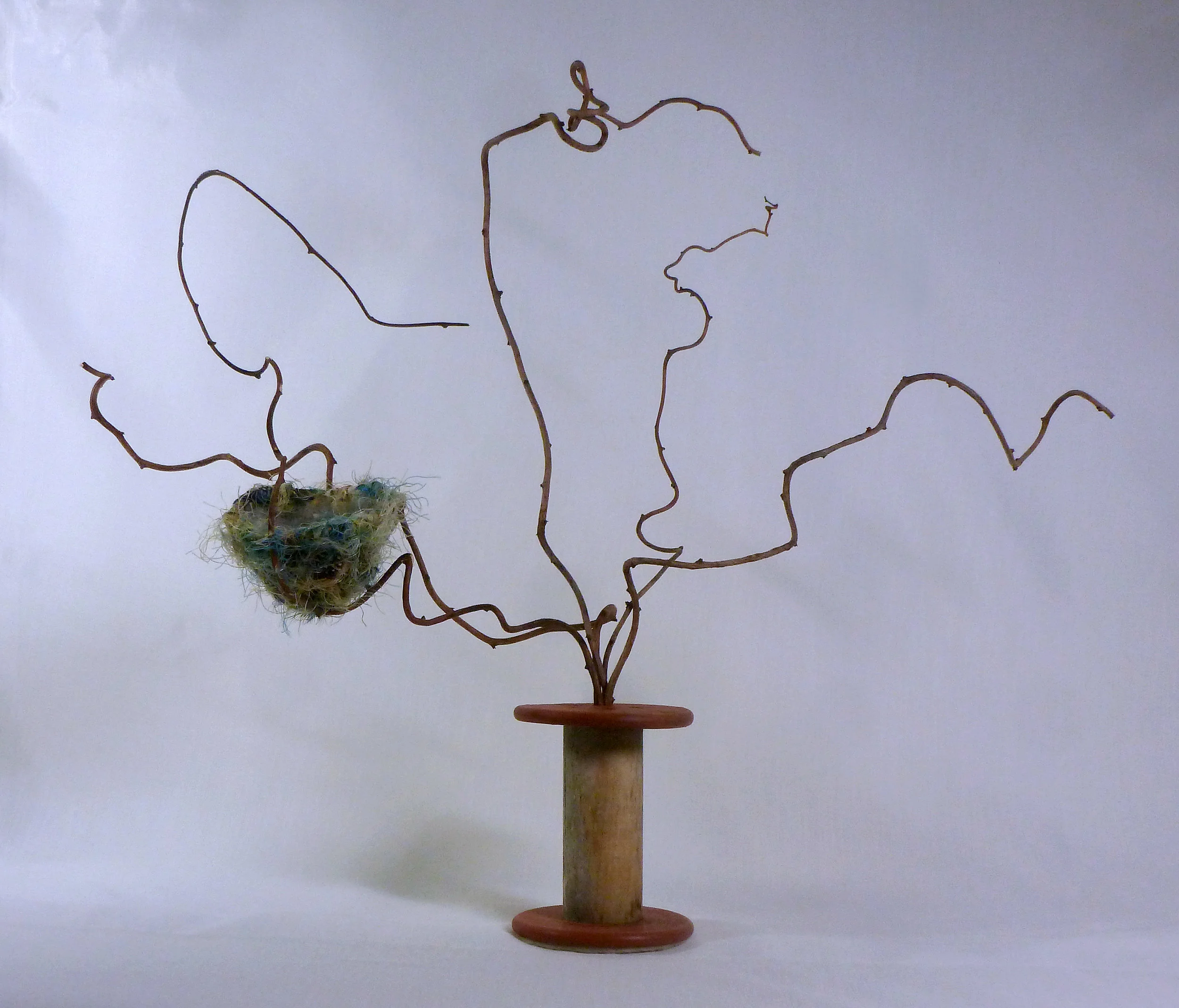 Nest II - Comfort: Vintage spool, found sticks, florist's wire, thread, yarn. (23" tall)