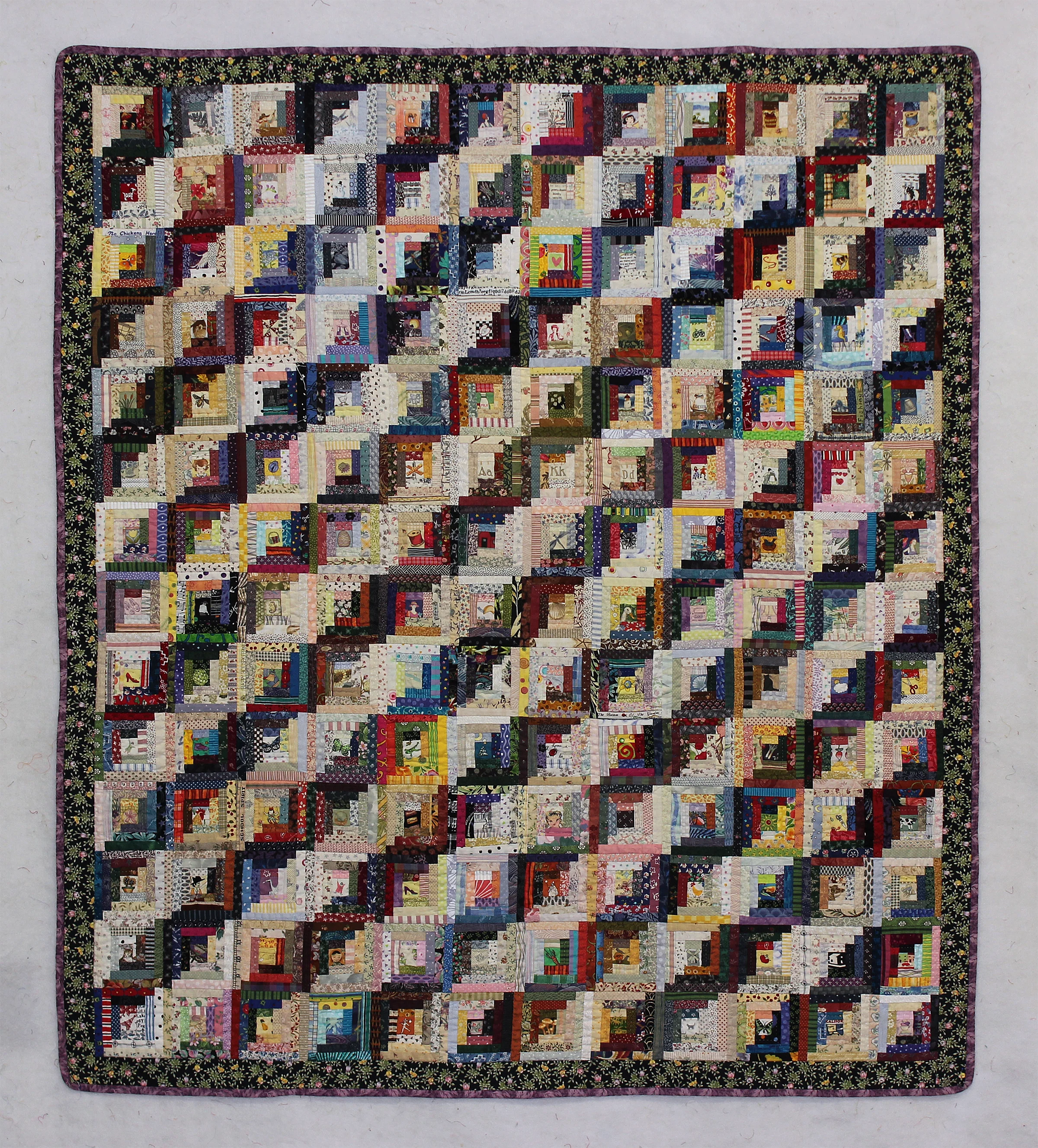 Alma's Quilt: (Made for my mother, late in her life when she was wheelchair bound). Log cabin paper-pieced pattern. Machine pieced & hand-quilted.
