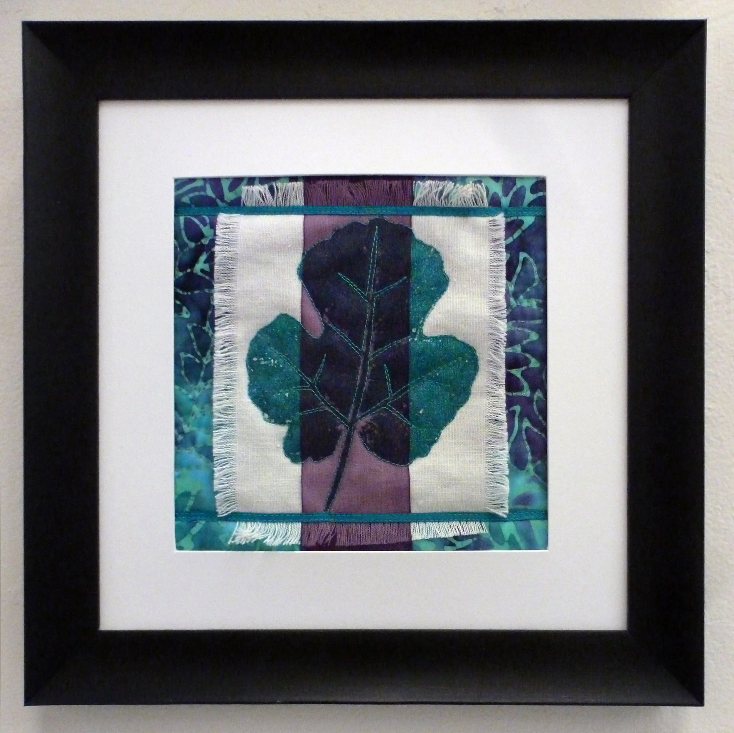 Eve's Sunday Best: Fig leaf printed on vintage linen, ribbons. Machine & hand quilted. (8" x 8")