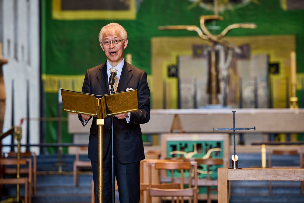 His Excellency, Ambassador Hayashi of the Embassy of Japan, London, gives his acceptance speech and opening address to the Children's Festival before presenting a Certificate of Commendation 