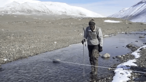 Stream technician Jade Lawrence measures stream flow in the Onyx River at one of two sites monitored continuously for nearly 50 years. Video by Ariel Zych