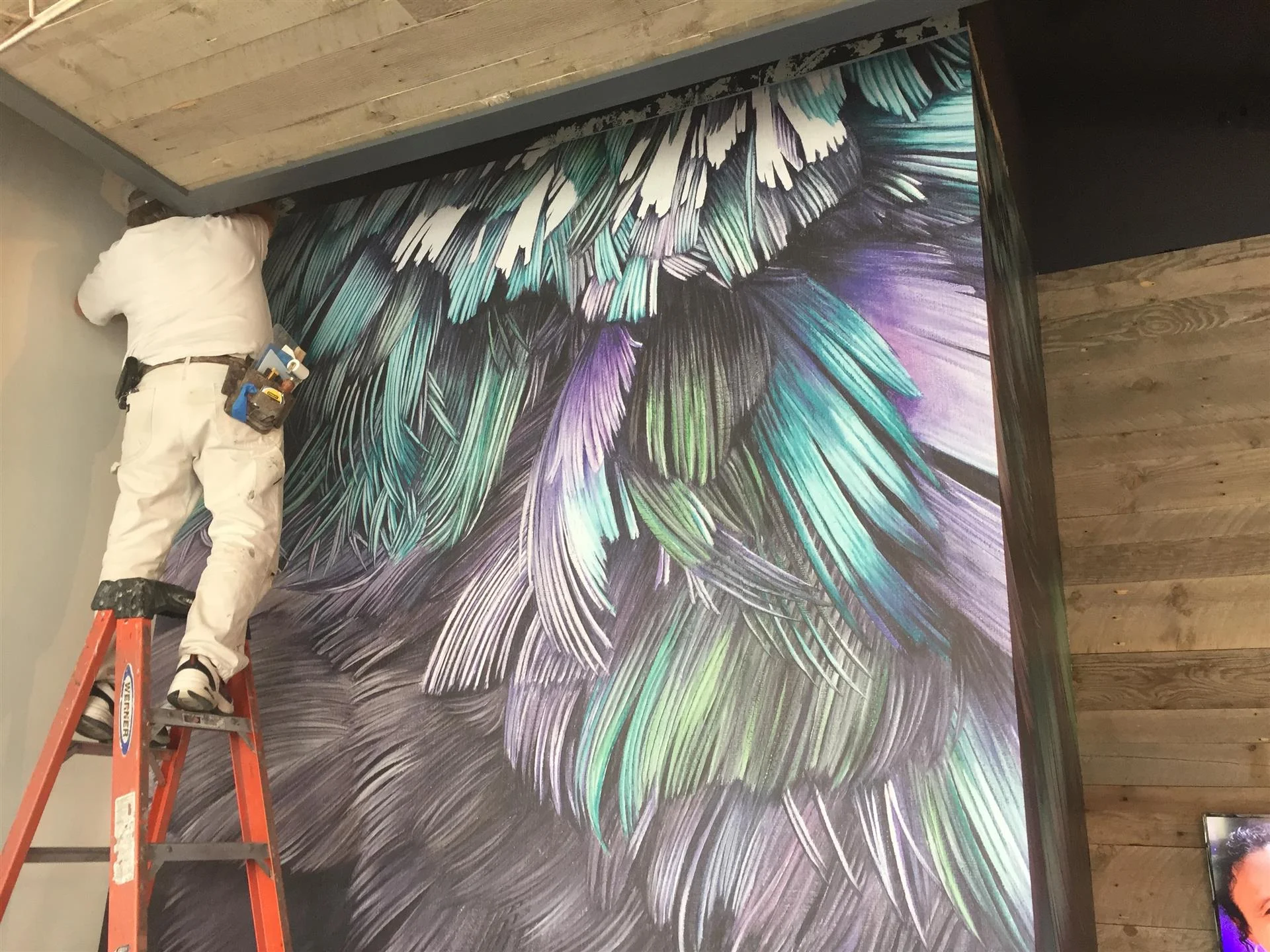 Craig installs Area Environments "Feather Wall" at YogaCenter North Loop