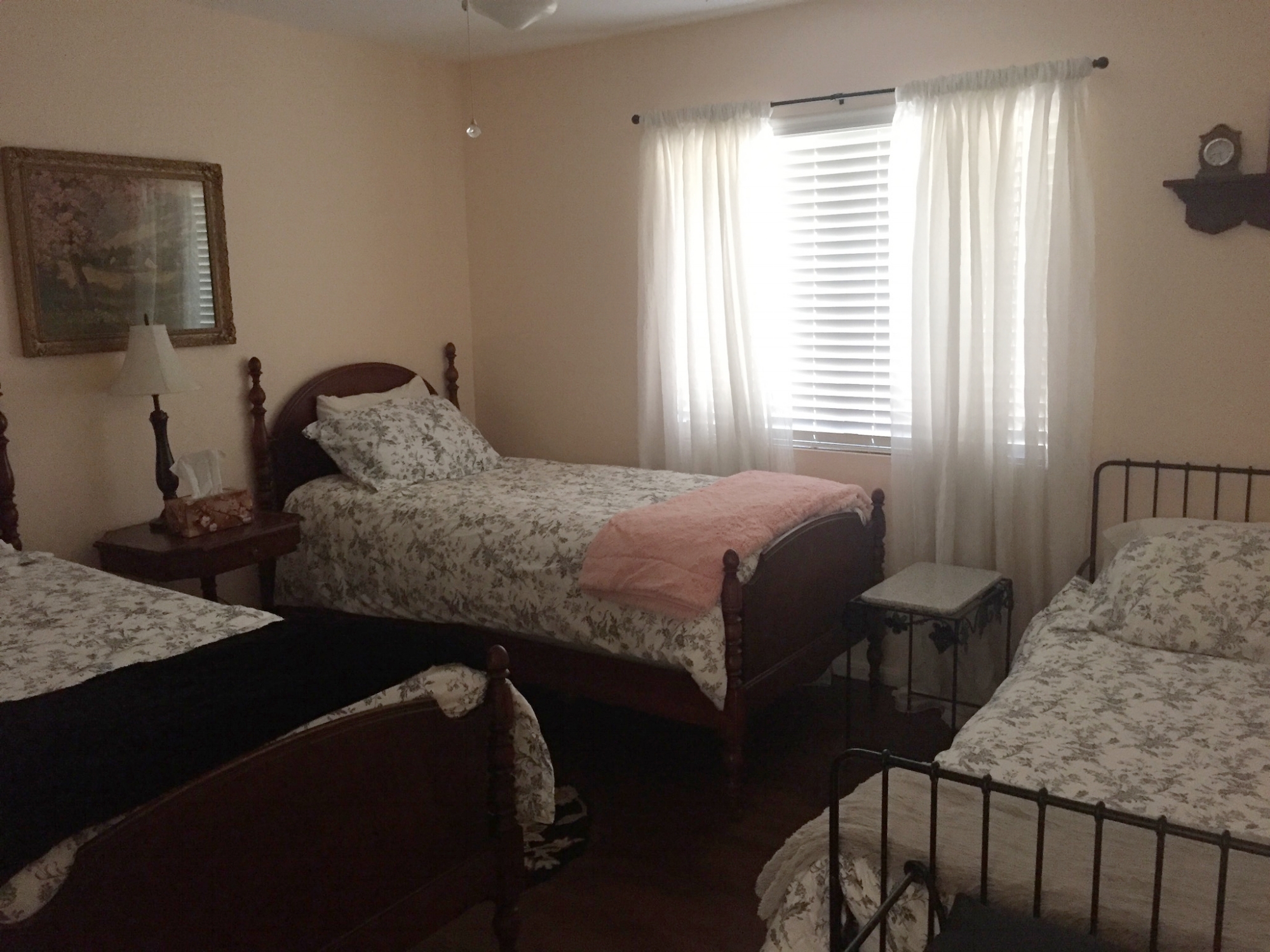 Orange room showing three twin beds