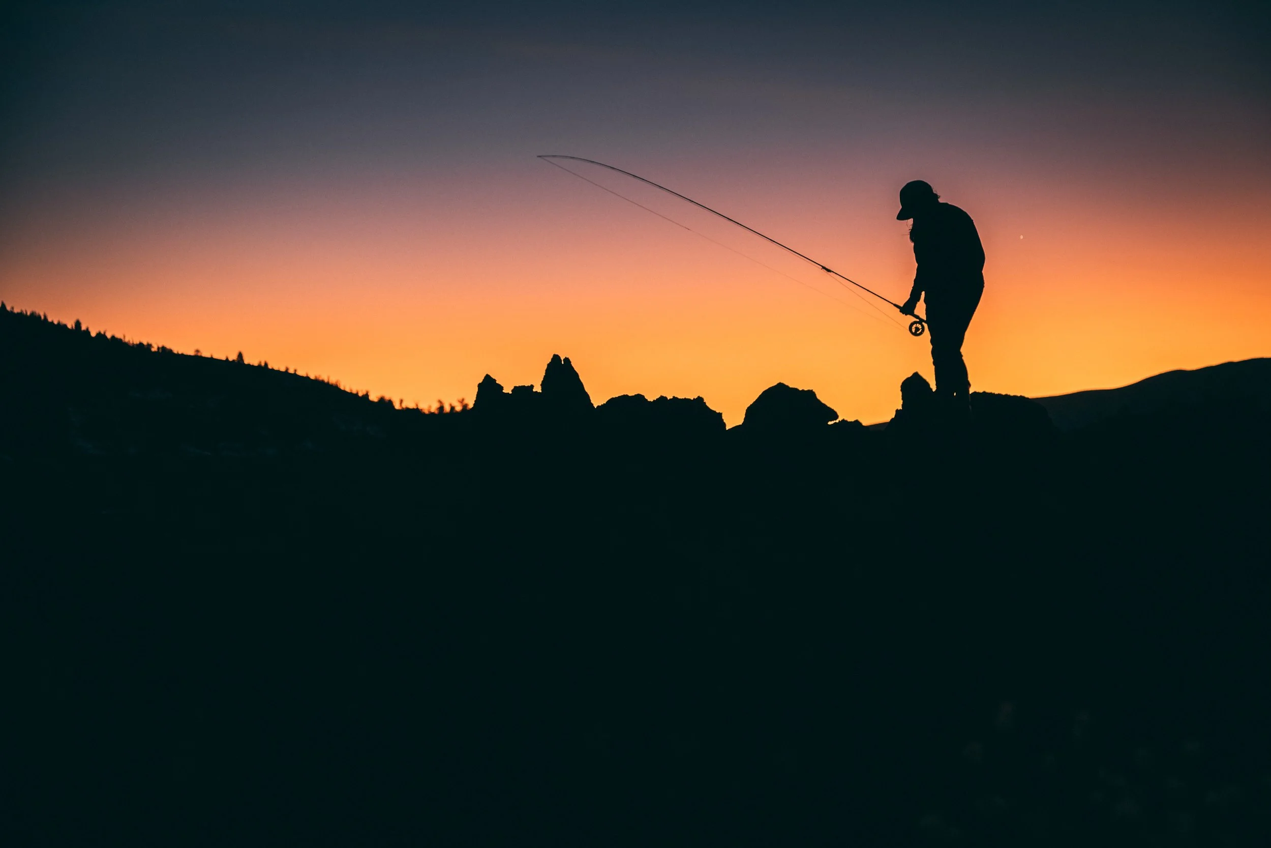 sunset holding rod_.jpg