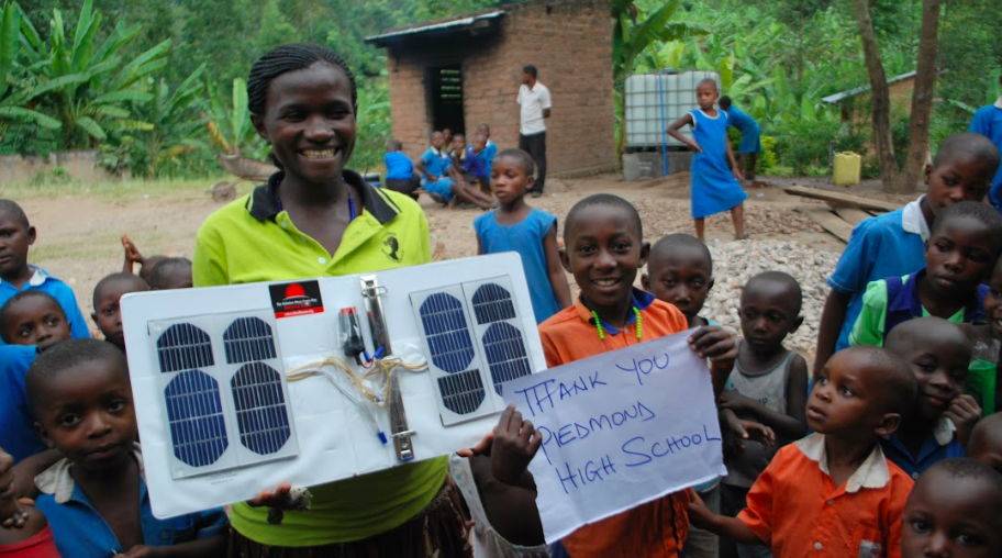 We deliver technology - we gave these solar cell phone chargers to Kanyenze Humanist Primary Schools, in Uganda
