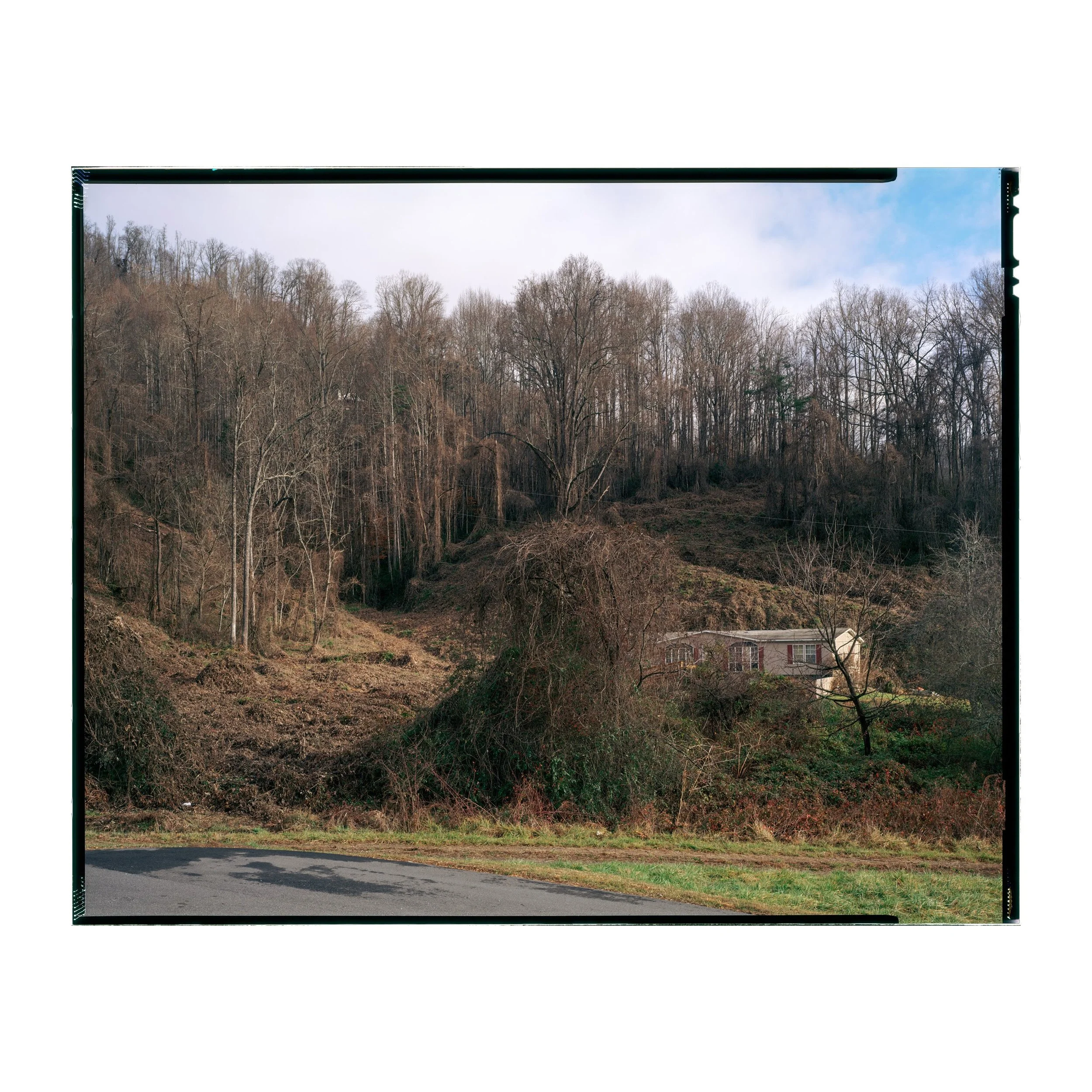 HOUSE AT FOREST&rsquo;S EDGE, Western North Carolina (2026) #notchcode

8x10&rdquo; E100 Film

This view of a home sitting, and indeed nearly hidden in the forest behind a parking lot in the rural American South does not indicate much of the document
