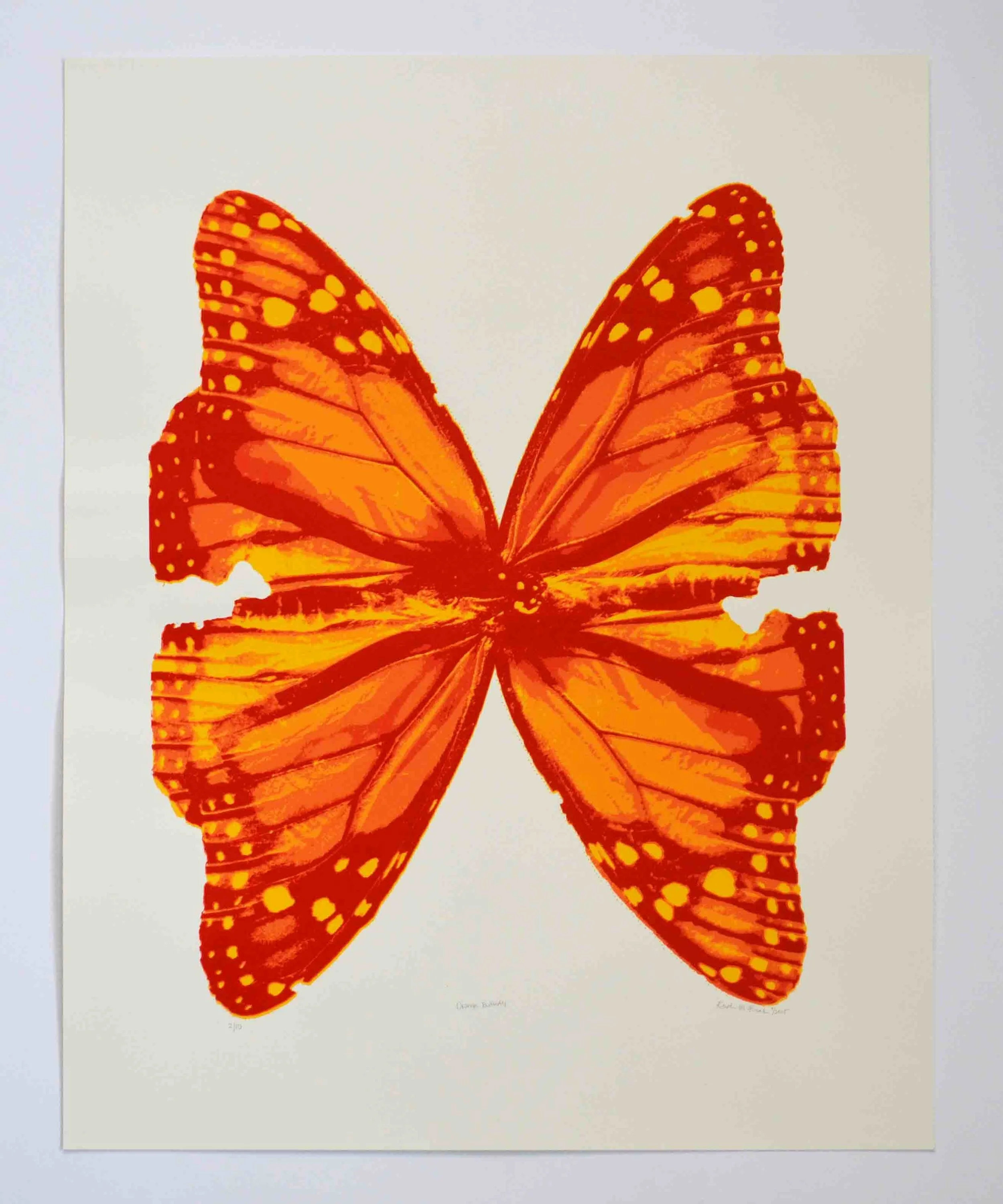 Photo of the screen print tiled "Orange Posterized Butterfly." This print features two monarch butterflies positioned to look like one large butterfly. It is by Kristin Frank.