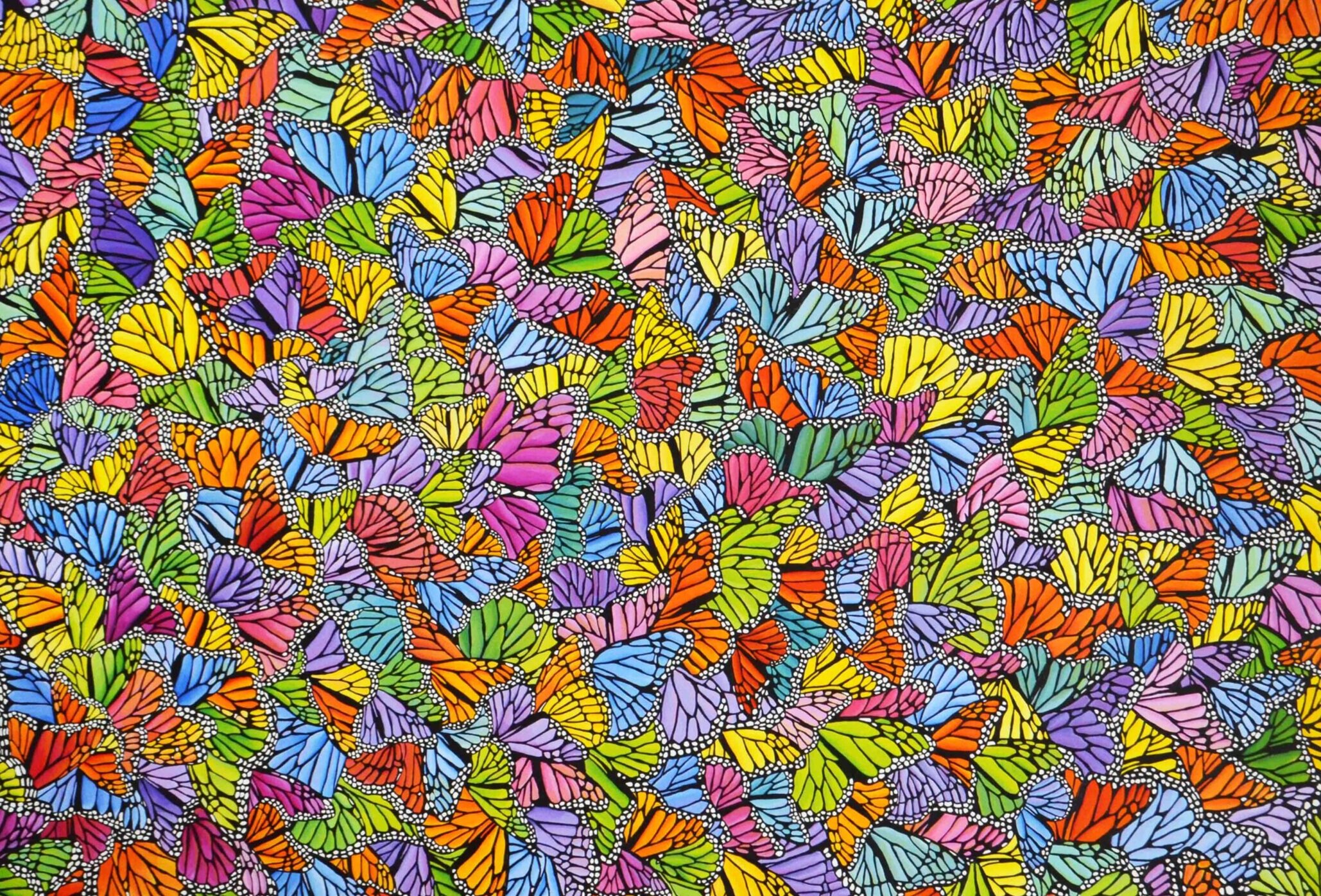 Photo of the oil painting "Colorful Monarch Migration" by artist Kristin Frank. It features hundreds of colorful monarch butterfly wings. The butterflies are clustered together for the winter.
