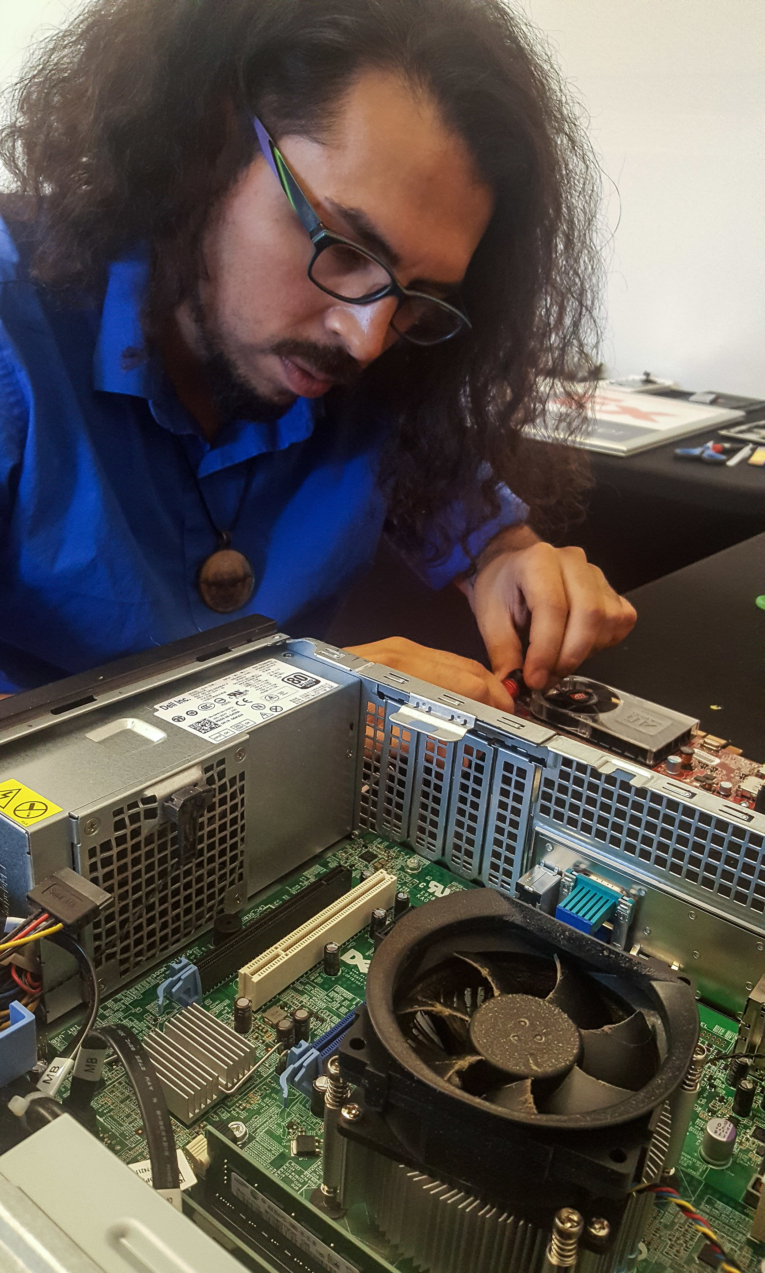 BadApple Owner Leo Trujillo Repairing a broken Computer