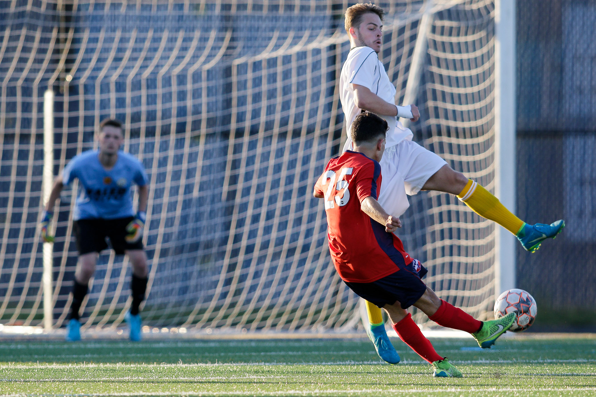  Santi Cardona tries a shot on goal, but it is deflected by a Greater Lowell FC defender. (c) Burt Granofsky 