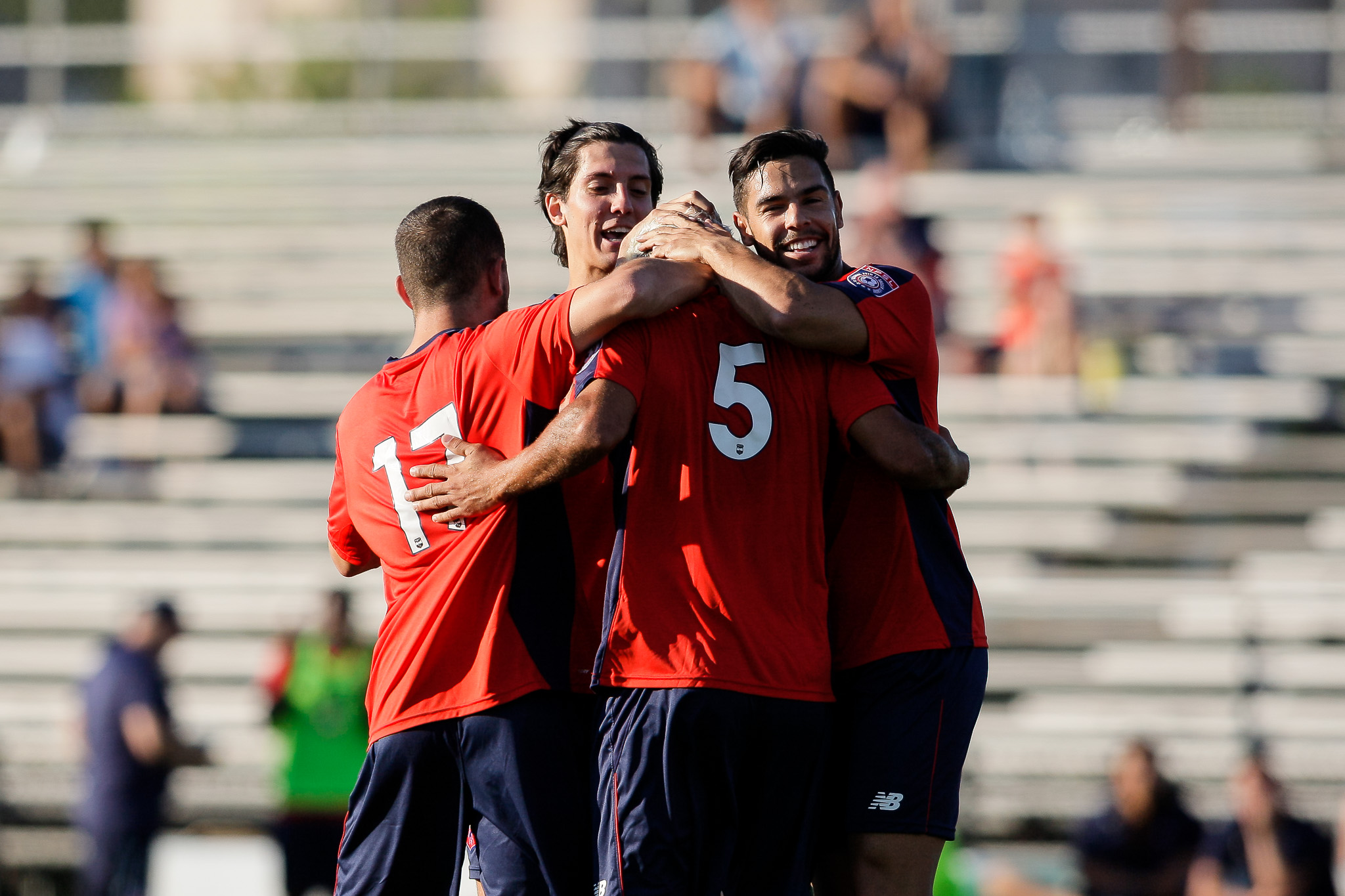 Boston City FC players mob Pedro Silva, #5, after he scores to even the game at 1-1. (c) Burt Granofsky 