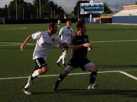 PDXFC’s Blake Leonetti battles his former teammate Steven Evans of FC Mulhouse Portland in a “Black & Blue” Derby. (Photo Courtesy: Michael Eastman/Vox Populi Images)