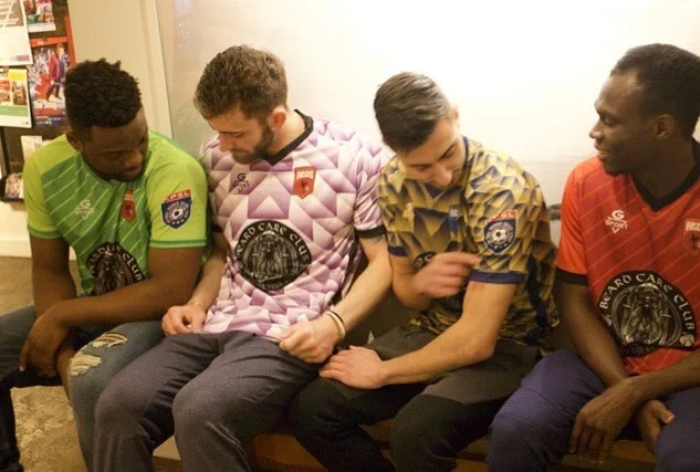 Club players trying on the new kits. Image courtesy of Rhode Island Reds FC.
