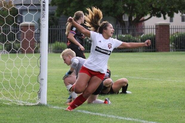 Delaney Romero of the Reds sinks Twin City Union in the 2019 NWPL playoffs.