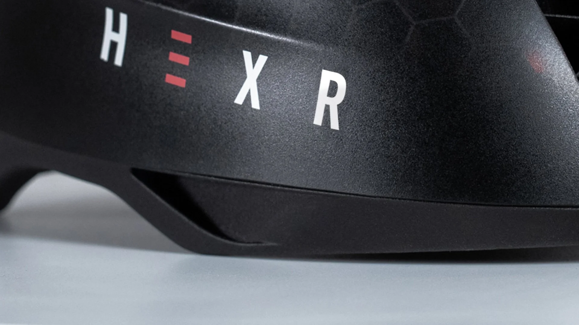 Hexr - helmet - photography - black - curventa - design - model - cycling - performance - transparent - hex - 3D print - aero - custom - headscan - detail - closeup - photo - red - white - aerodynamic - polycarbonate - logo