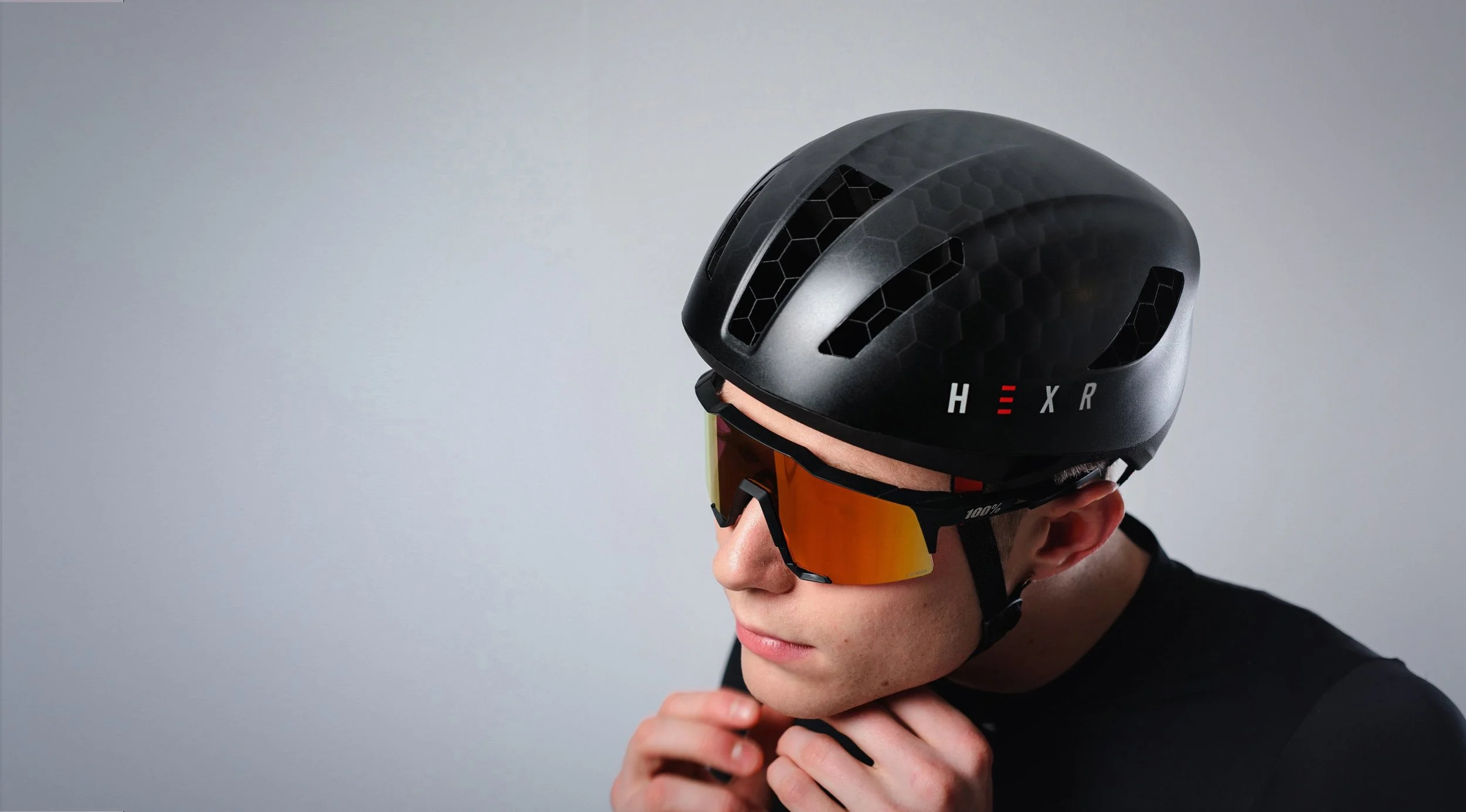 Hexr - helmet - photography - black - curventa - 3D printed - glasses - headgear - straps - male - vents - ventilation - transparent - hex - views - aerodynamic - details - strapping on